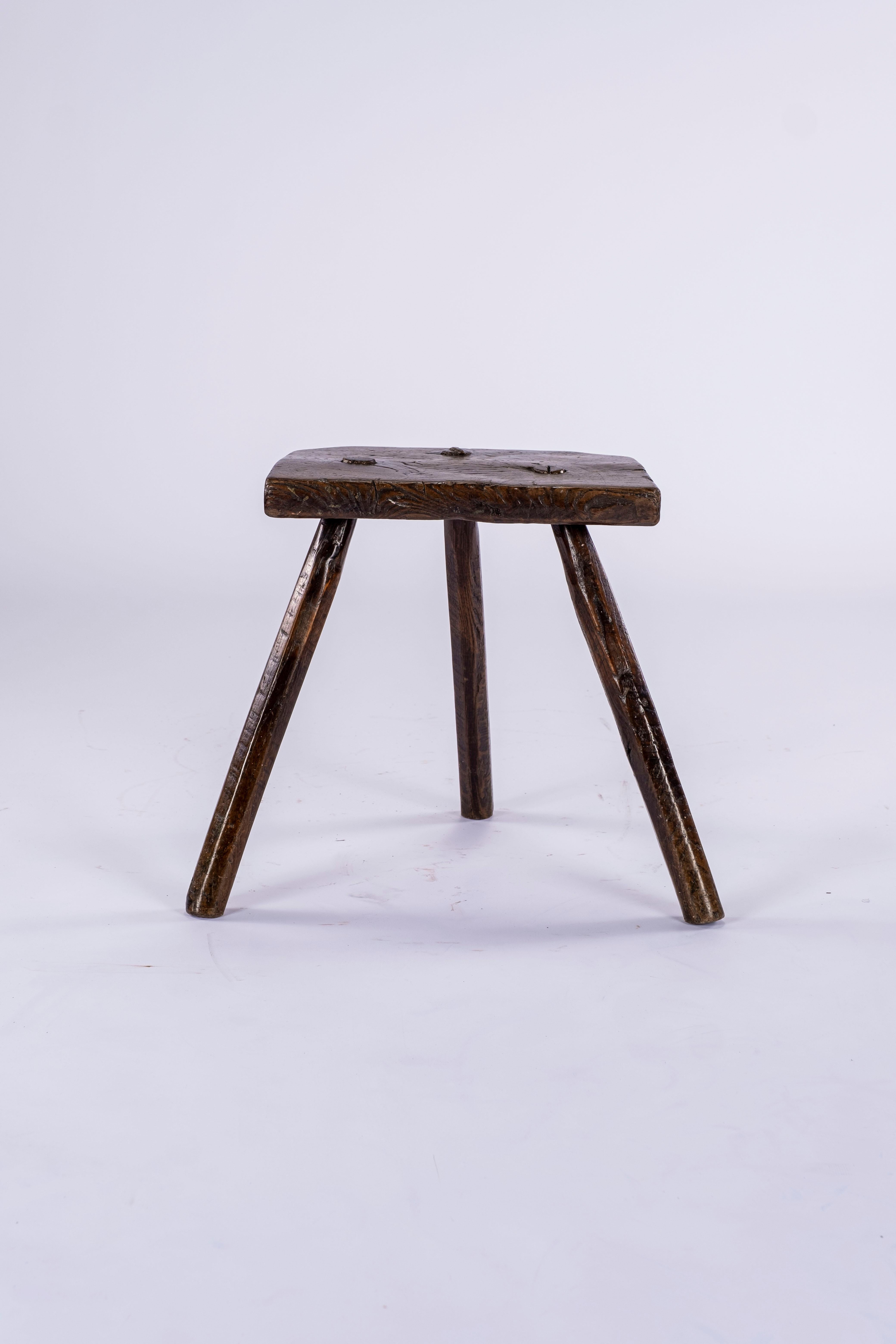 Early 19th century English Cutler's stool used by workmen in the Sheffield Cutlery Company. Legs have ribbed detail. Beautiful patina. Would make a wonderful side table. Legs extend beyond seat: Legs width: 21.75