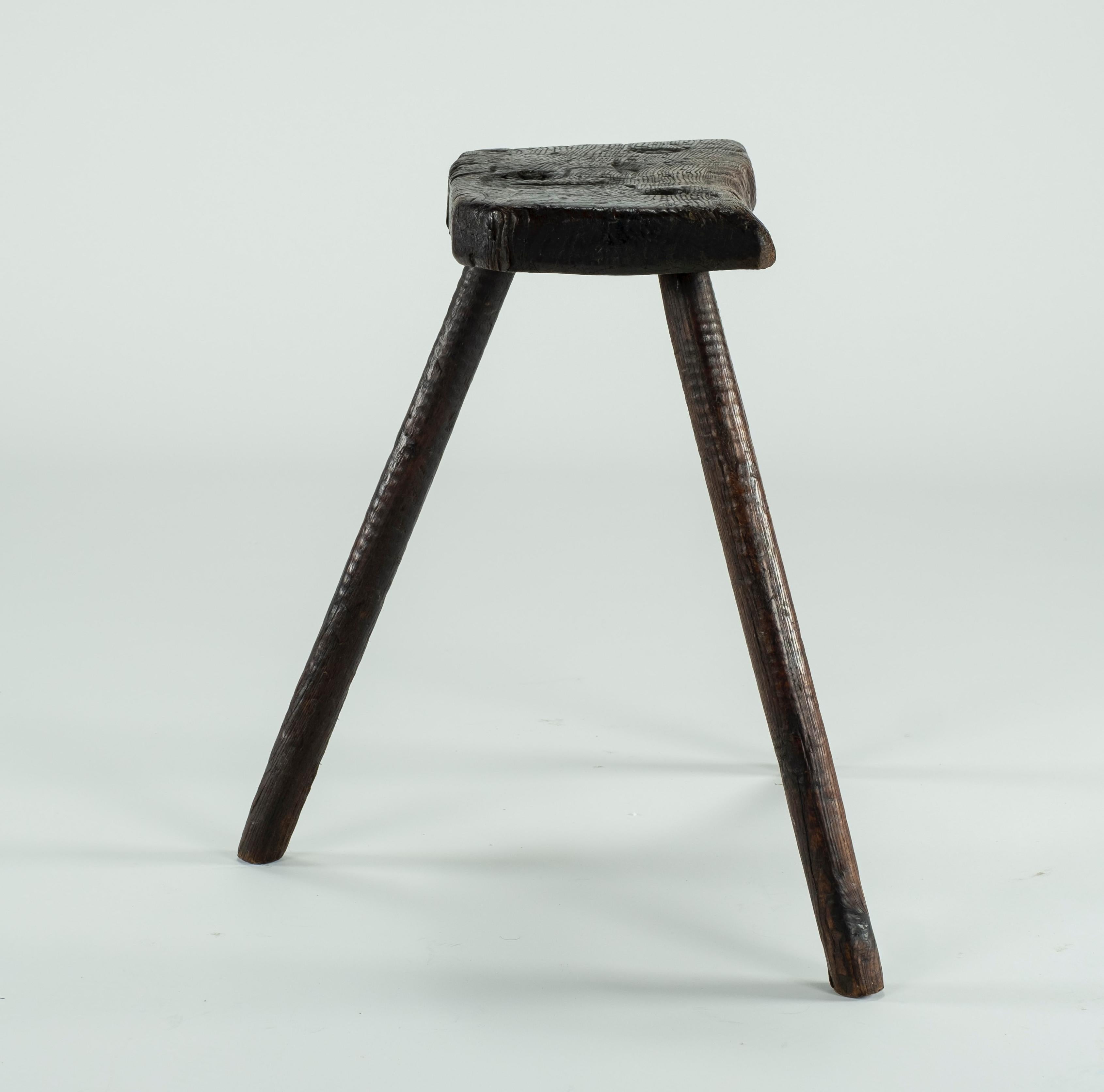 Beautiful example of the 19th century Cutler's stools used by the craftsmen in the cutlery factories such as Sheffield's. Initials of JS (?) carved into the seat. Great patina.