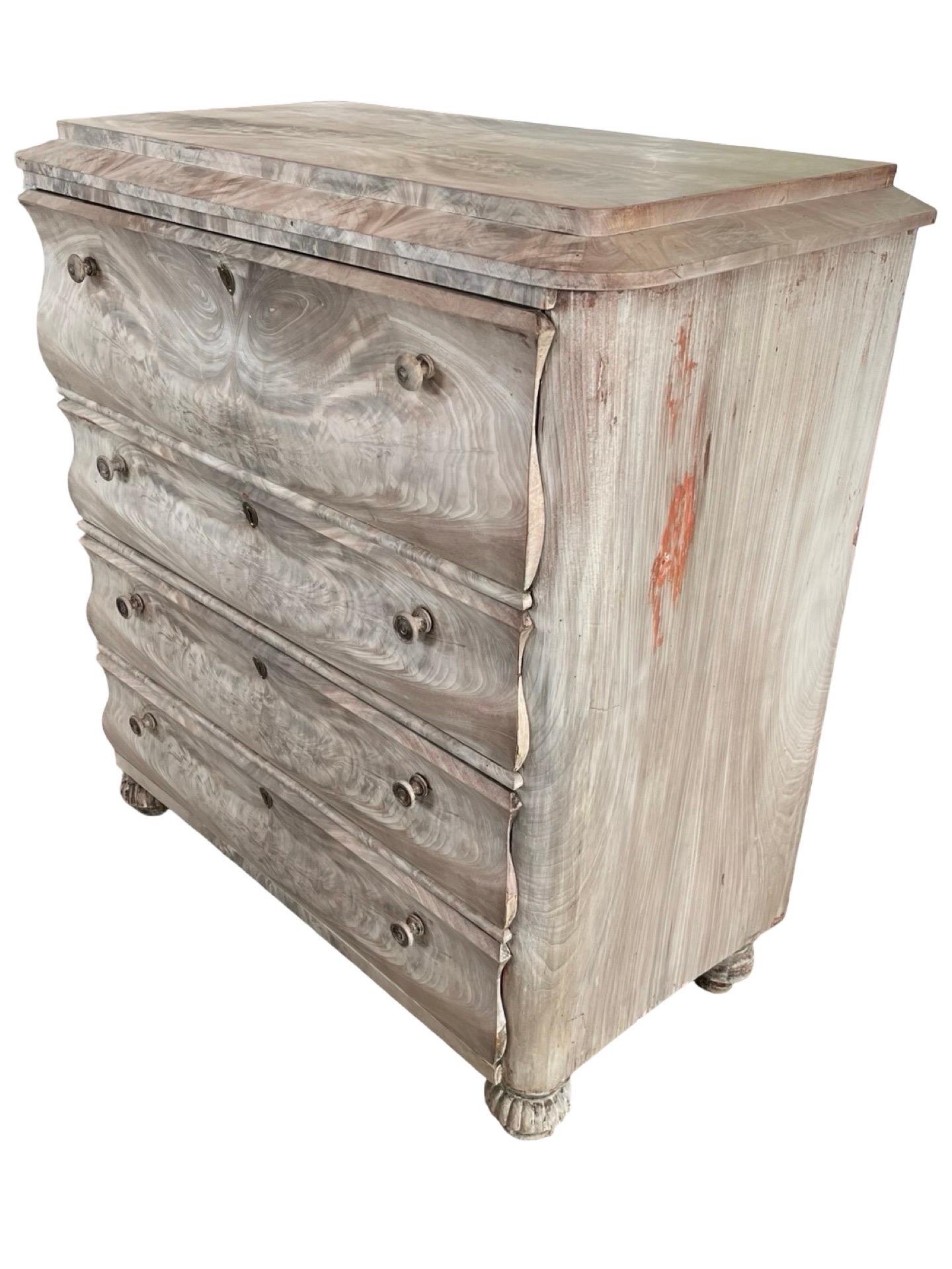 Biedermeier Secretary chest of drawers hand-made in Denmark in the early 1800s using mahogany. The piece is decorated with a masterly-laid book-matched mahogany burl veneer, and the alternation of colors of the grain of the bleached wood are just