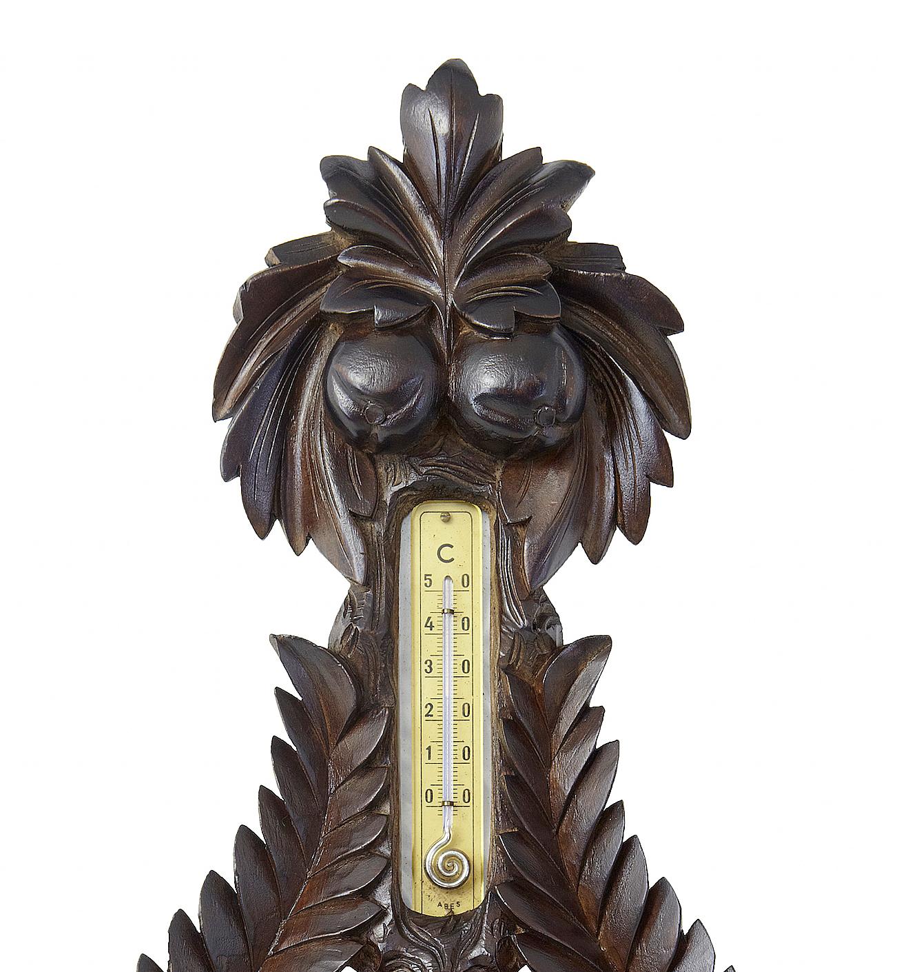 19th century Danish carved walnut barometer, circa 1890.

Beautifully carved from a solid piece of wood. Thermometer set in the top. Barometer with paper dial in Danish.

Some losses to carving on outer edge, signs of water damage to the paper