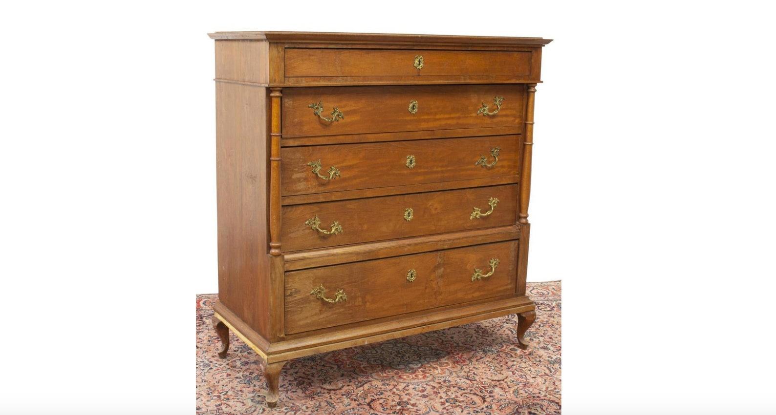 A monumental Danish chest of drawers commode from the 19th century. The magnificent, handcrafted Scandinavian antique having molded cornice, over case fitted with five drawers, all with dovetail joinery, the upper with divided interior and matched