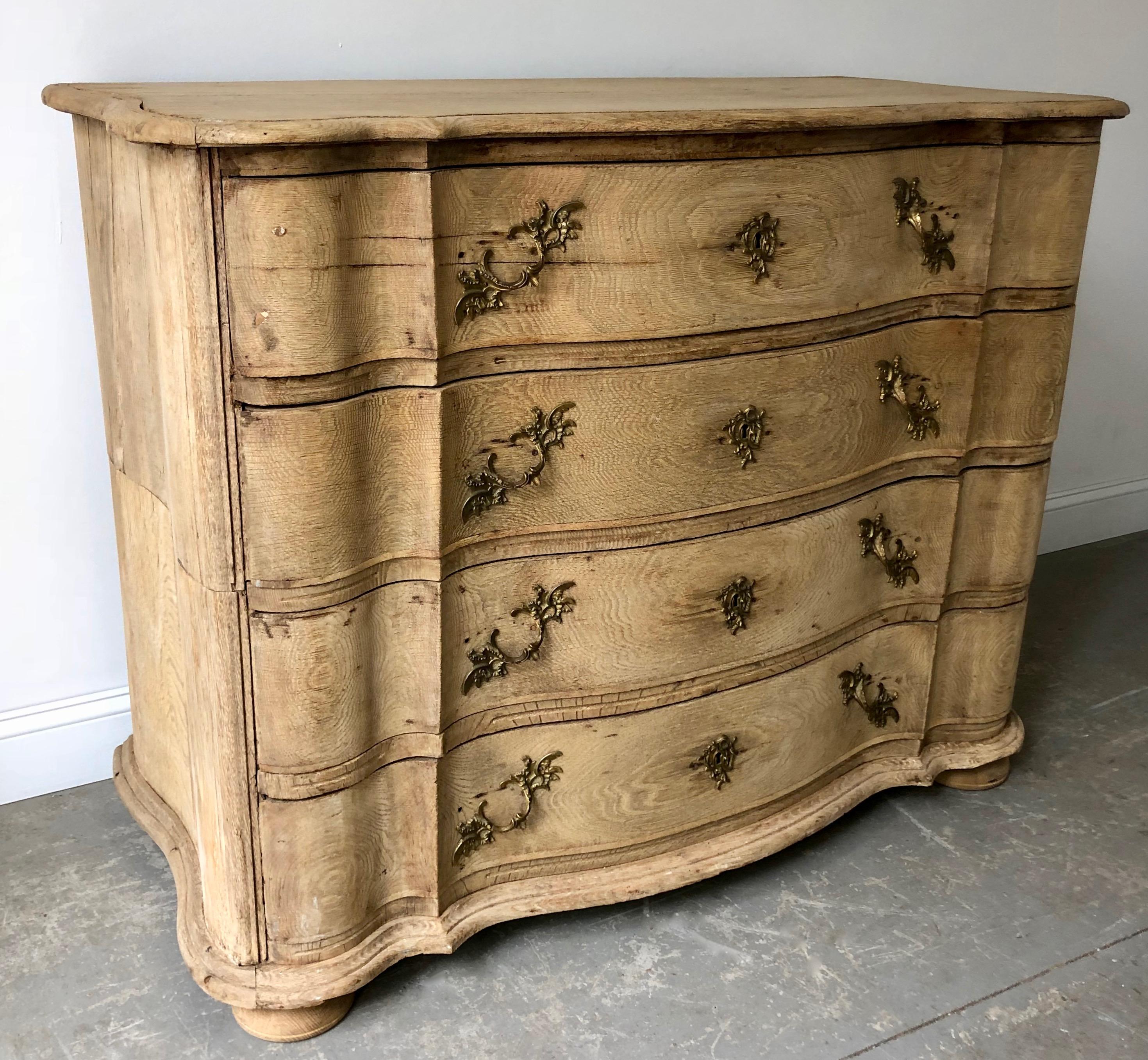 19th century chest of drawers in richly carved bleached oak with curvaceous serpentine drawer fronts, handsome bronze hardwares and shaped top on bun feet. The chest is in two parts for convent travels.
Denmark, circa 1850.
More than ever, we