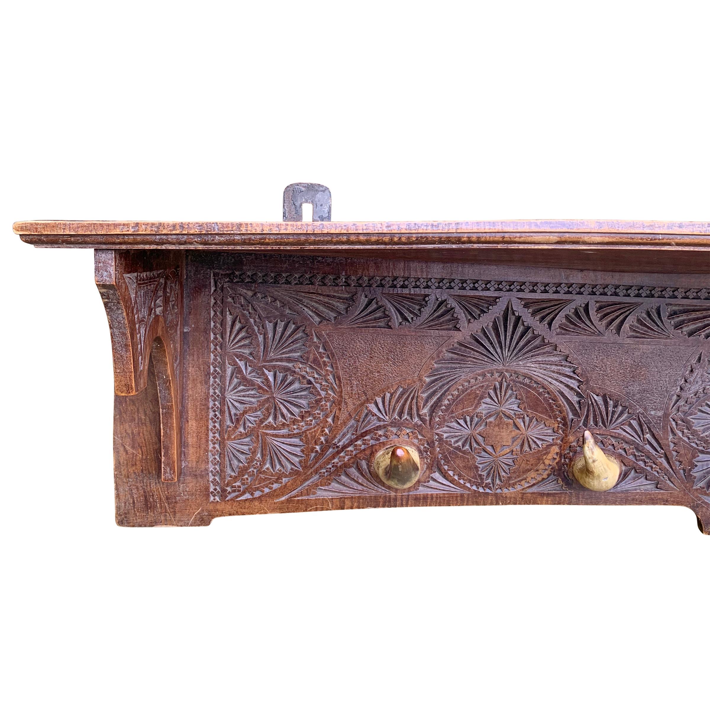 A whimsical 19th century Danish hat/coat rack with wonderful chip carvings and five cow horn hooks. This piece is substantially warped but in a super charming way. It's hung in our shop since we opened and functions wonderfully!