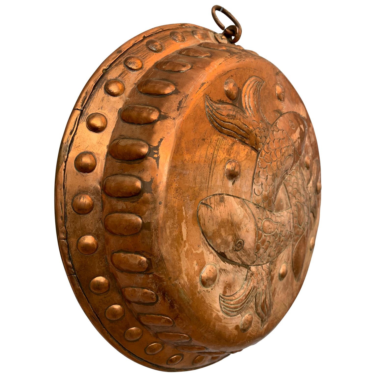 Danish 19th century copper bread mold with fishes motif.