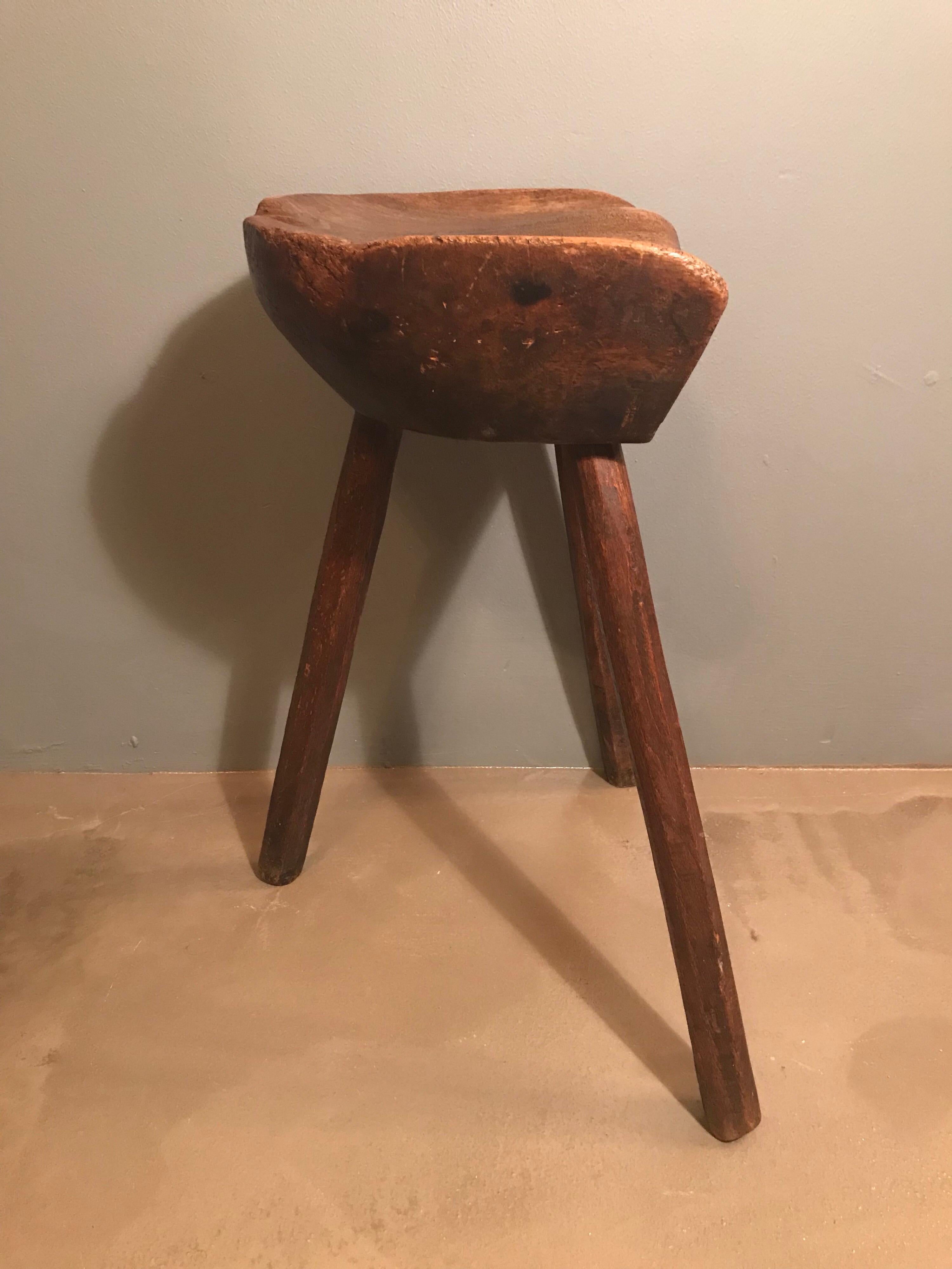 19th century Danish milking stool in cherry wood and oak.
Lovely wear and patina to the wood.
Very stabile.
Great piece of Folk Art.
 