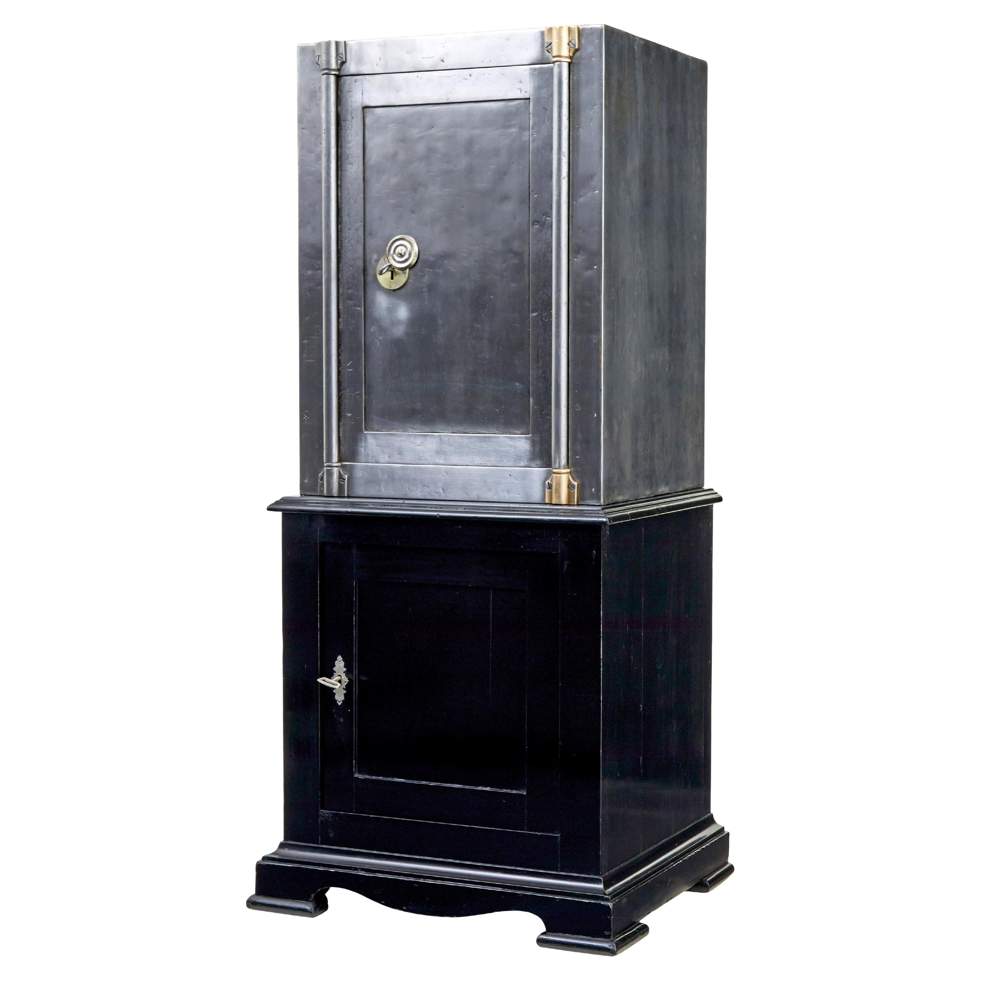 19th century Danish polished steel safe on cabinet