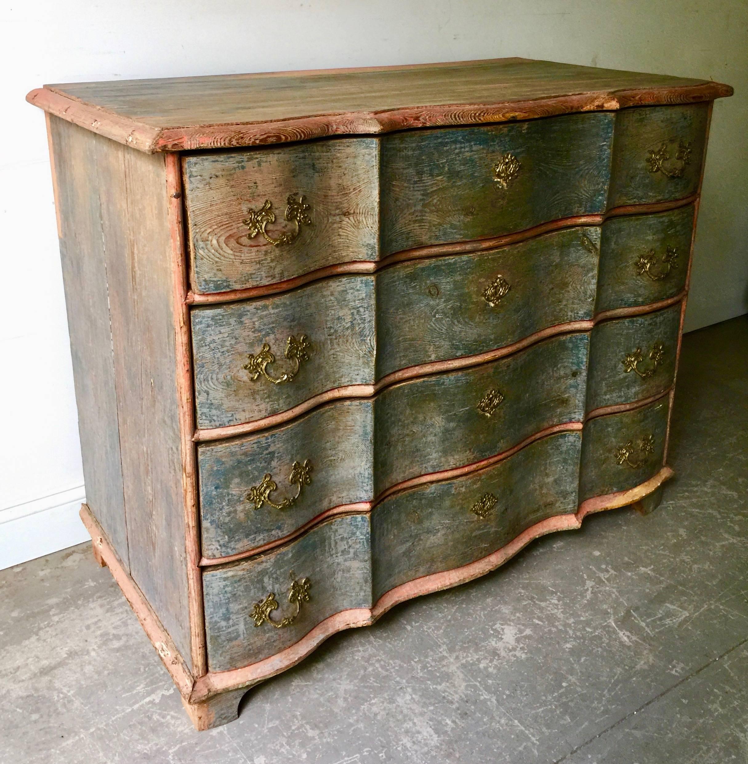 An exceptional 19th century Danish Rococo chest in brilliant time worn original paint with beautifully carved serpentine drawers with original handsome bronze escutcheons,
Denmark, circa 1880.
Surprising pieces and objects, authentic, decorative