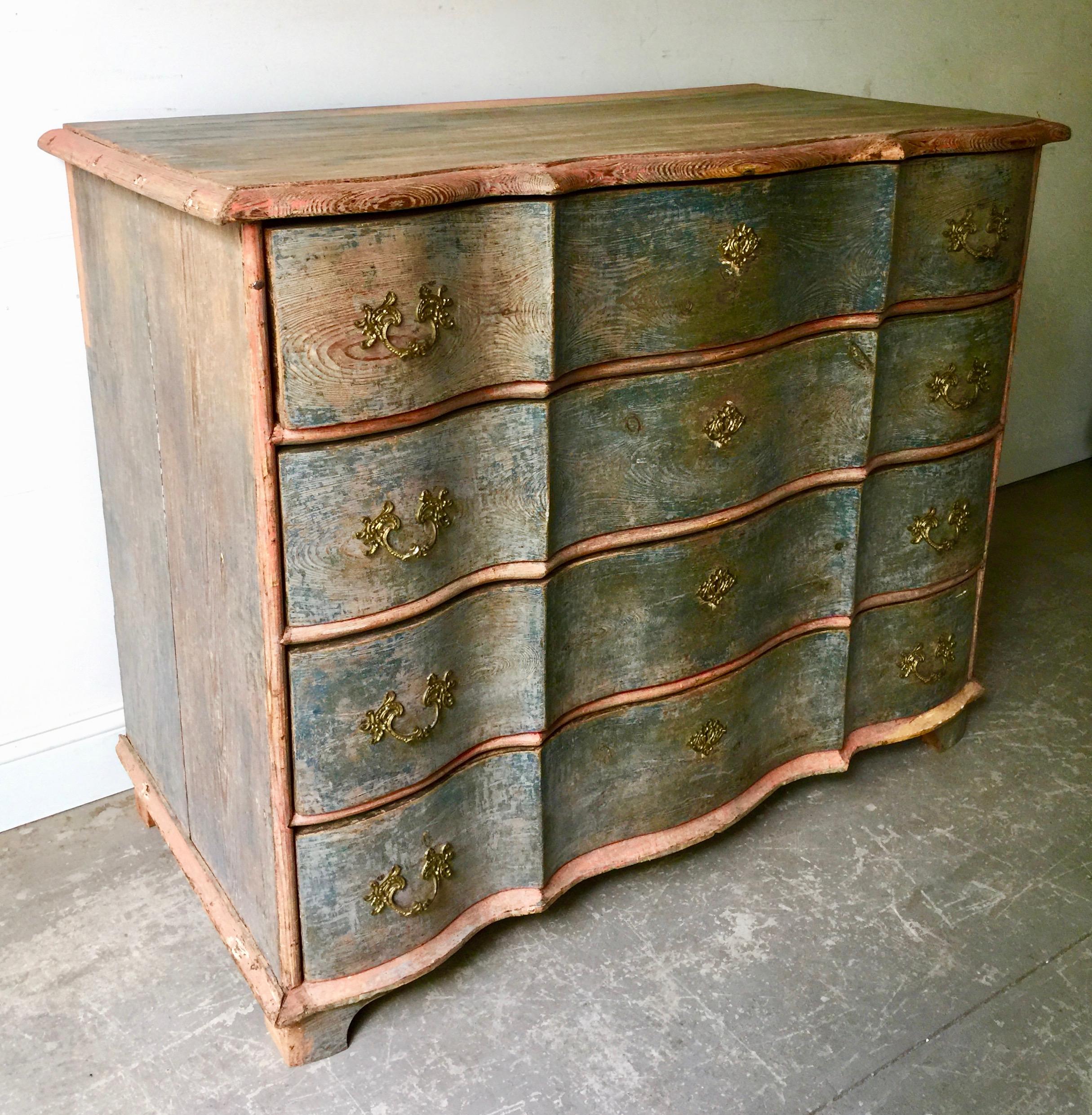 An exceptional 19th century Danish Rococo chest in brilliant time worn original paint with beautifully carved serpentine drawers with original handsome bronze escutcheons, Denmark, circa 1880.
Surprising pieces and objects, authentic, decorative