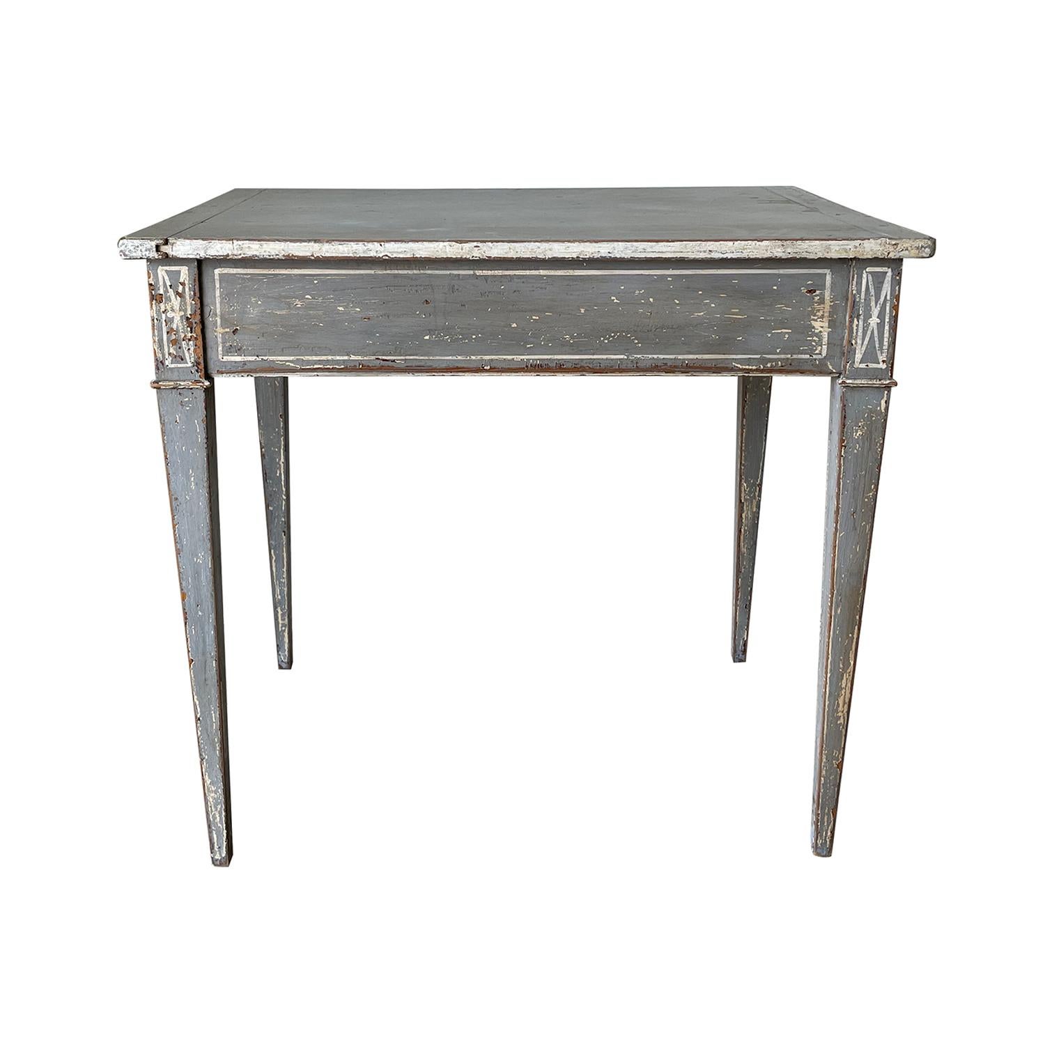 A dark-grey, antique Swedish Gustavian freestanding console table made of hand crafted painted Pinewood, in good condition. The small rectangular Scandinavian side, end table is standing on four straight, square tapered fluted legs, enhanced by