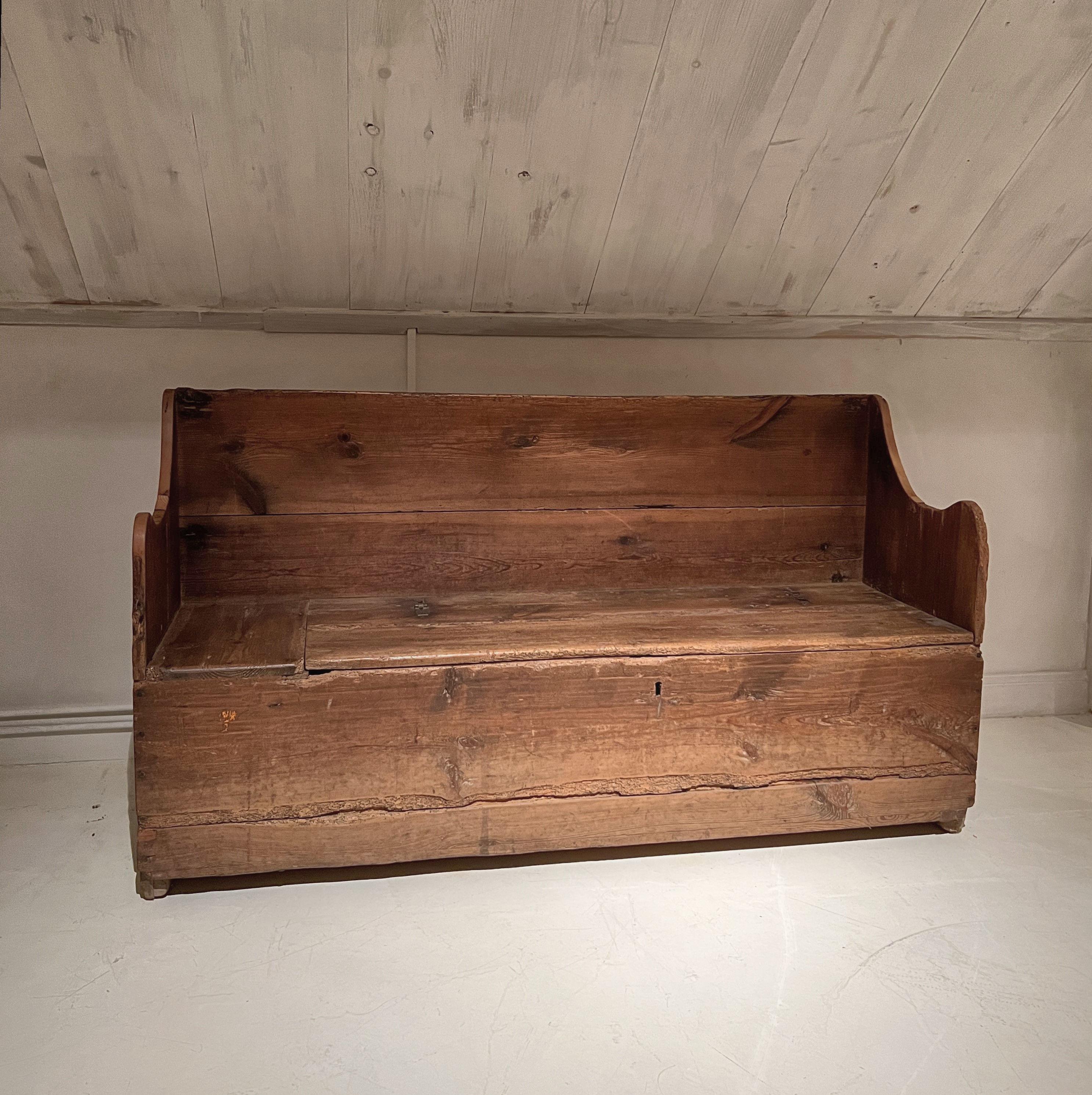 A great example of a Pyrinee mountain Bench. Beautiful grain, color and patina. Sturdy and ready for everyday use with modest dimensions. Rare features include a offering box which can only be accessed when the seat is opened. Furthermore it is