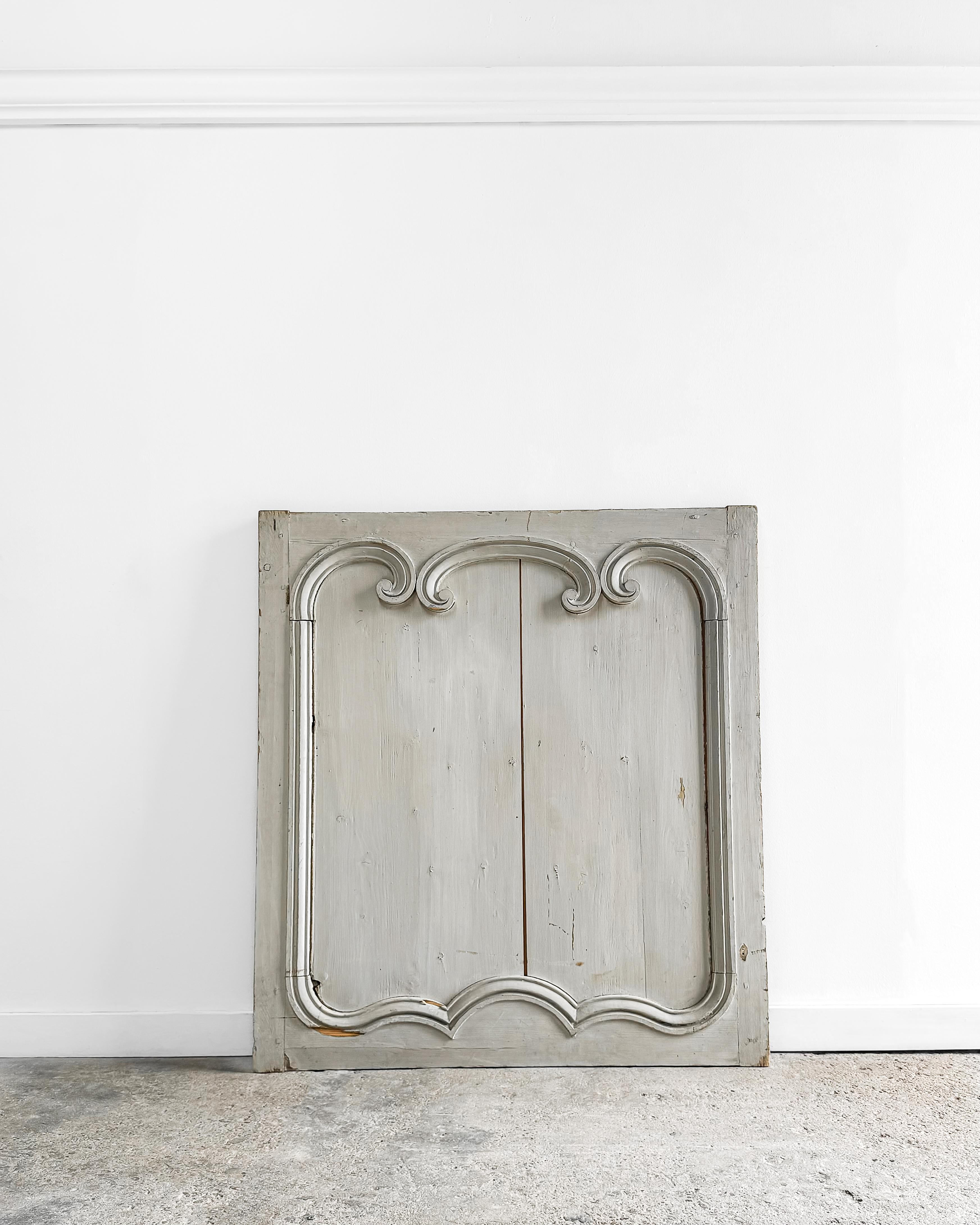 A beautiful 19th-century French boiserie panel crafted from solid wood. This decorative provincial architectural wall panel features its original, time-worn 