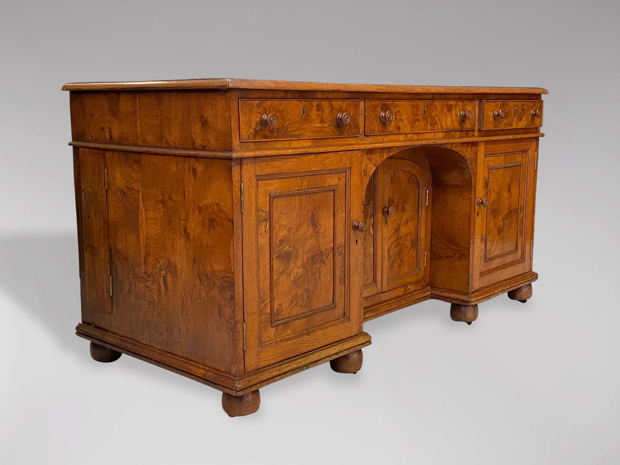 A stunning quality 19th century knee hole desk in pollard oak. Rectangular top above three oak lined drawers, above three cupboards, all standing on eight bun feet with brass castors. Warm rich colour and patina! Exceptional quality!

The