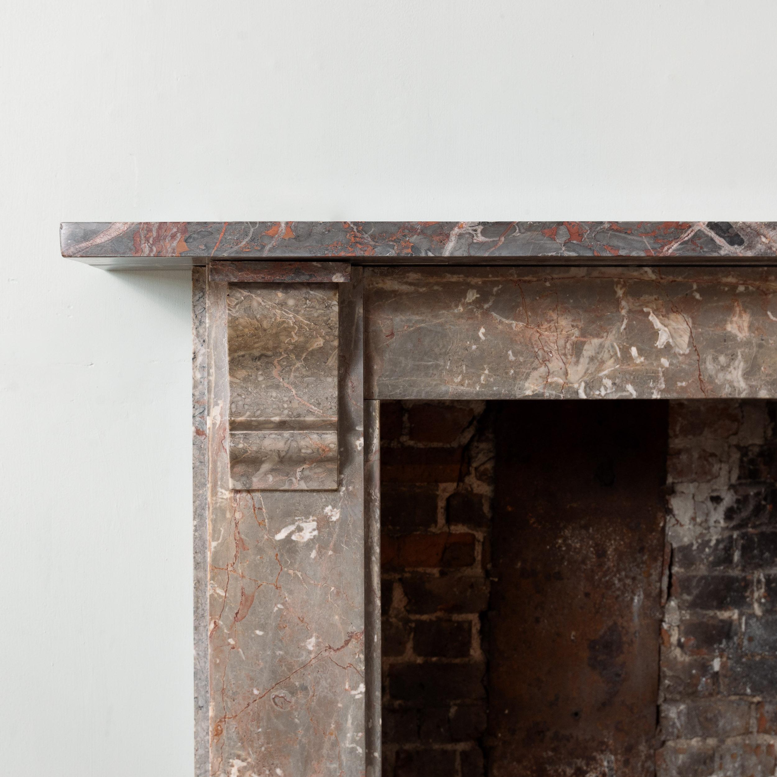A Nineteenth century Devonian limestone chimneypiece, mid-Victorian, with plain corbels to the jambs, the shelf original but of a slightly darker grade of stone.

Dimensions:	110.5cm (43½