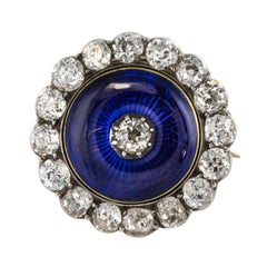 Spilla in oro bianco giallo con diamante e smalto blu del XIX secolo