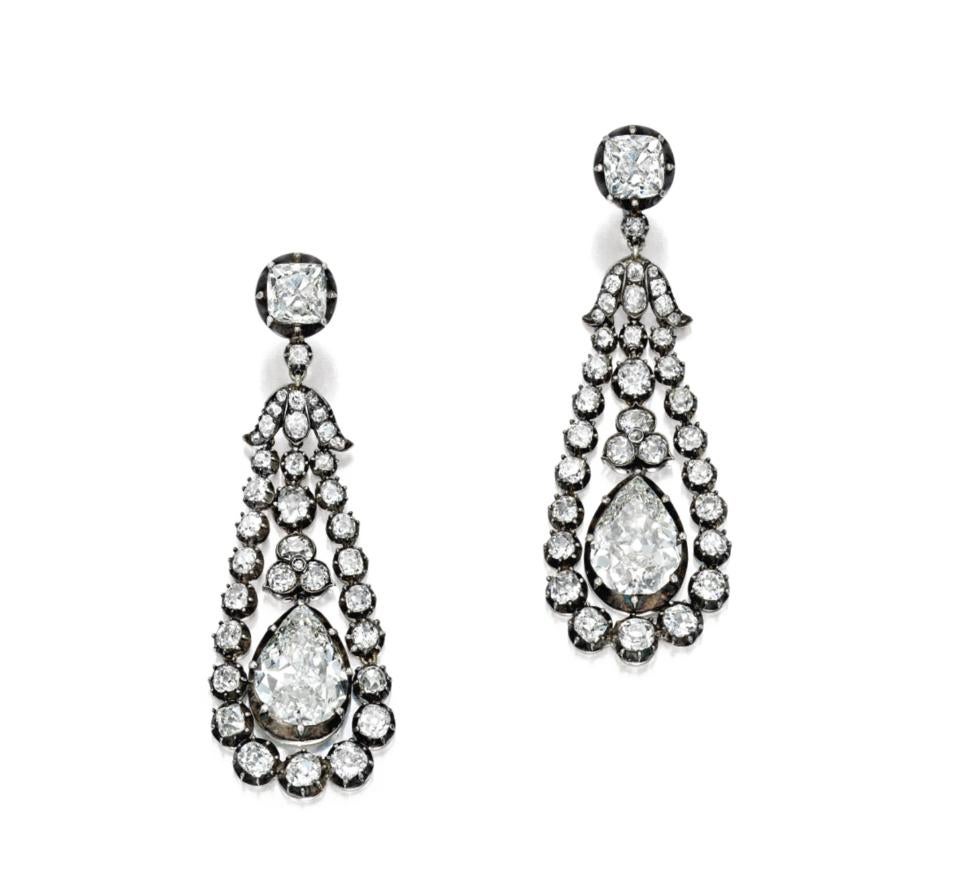 For the royalty and celebrity in all of us.  Each in pinched collet setting, suspending a pear-shaped diamond within an old mine-cut diamond hoop, to the similarly cut diamond surmount.  Each pear shape diamond is guaranteed to be AT LEAST 5.5