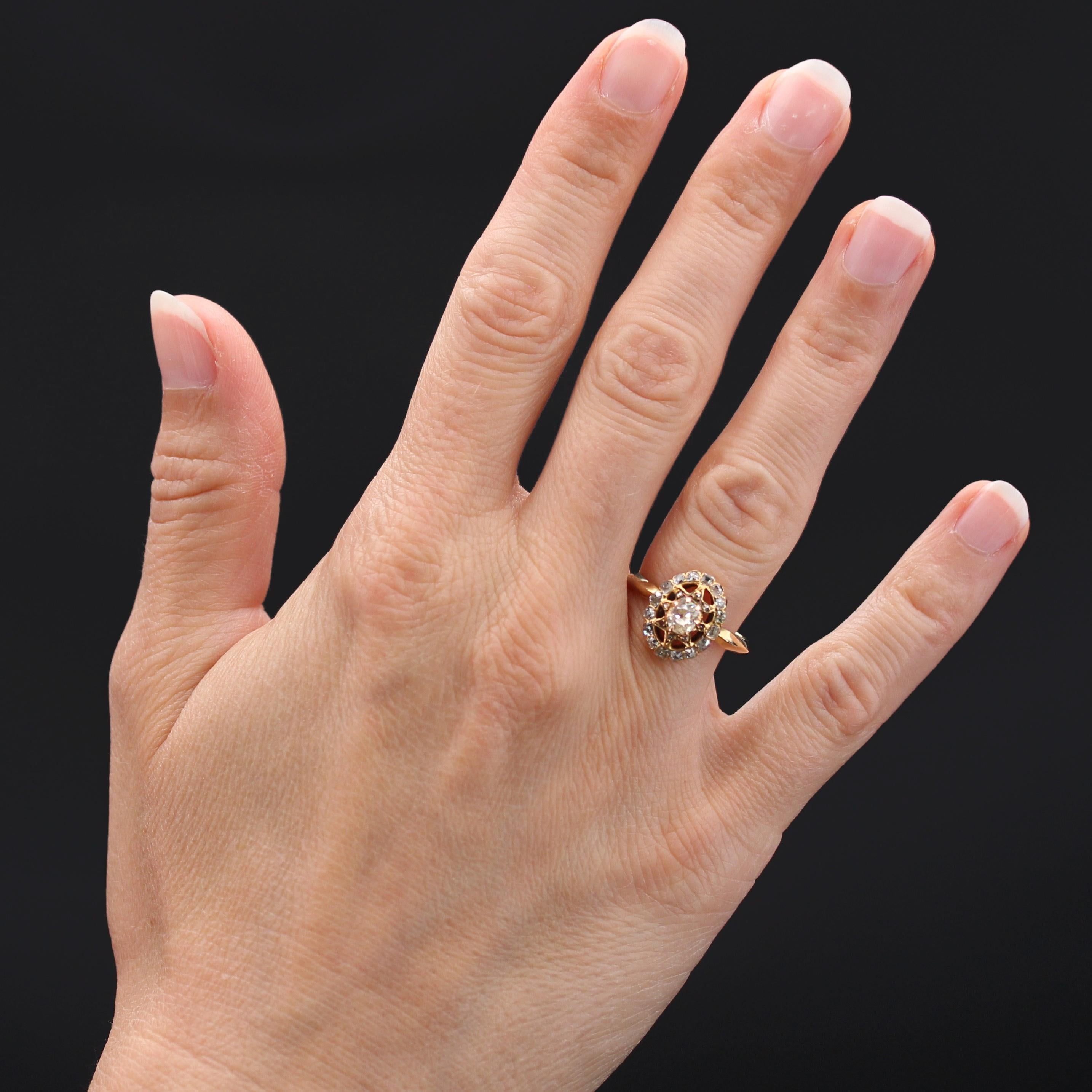 Ring in 18 karat yellow gold.
Of oval shape, this charming antique ring is decorated with claws on the top of an antique cushion-cut diamond, on a starry decoration decorated with small rose- cut. The ring is set with antique cushion-cut and