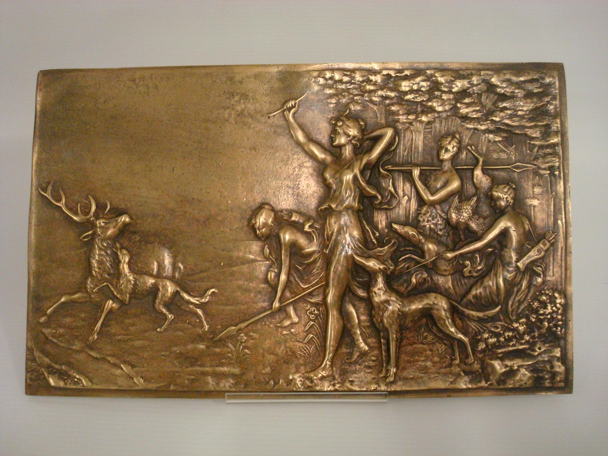 19th century diana the huntress bronze bas relief wall plaque. Diana with raised bow and hunting dog near her side.