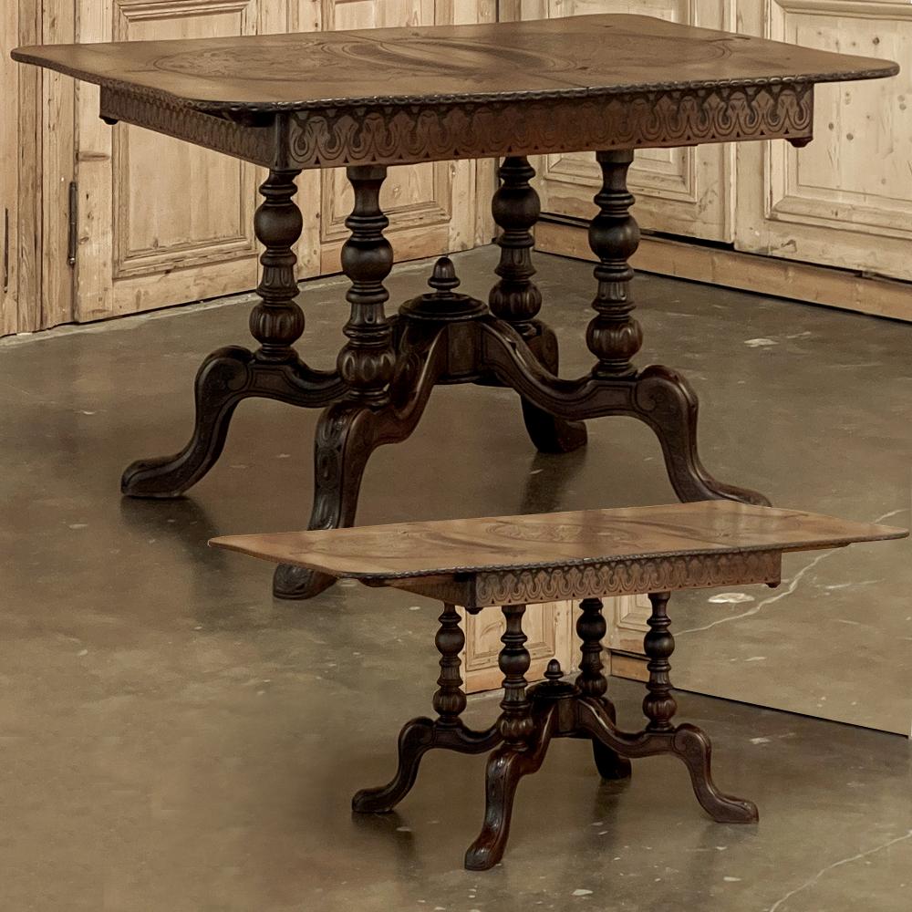 19th Century dining table by Horrix with original carved leaf is yet another example of the superlative craftsmanship exhibited by the storied maker during the period. Set upon an unusual base with four turned pedestals atop a boldly scrolled