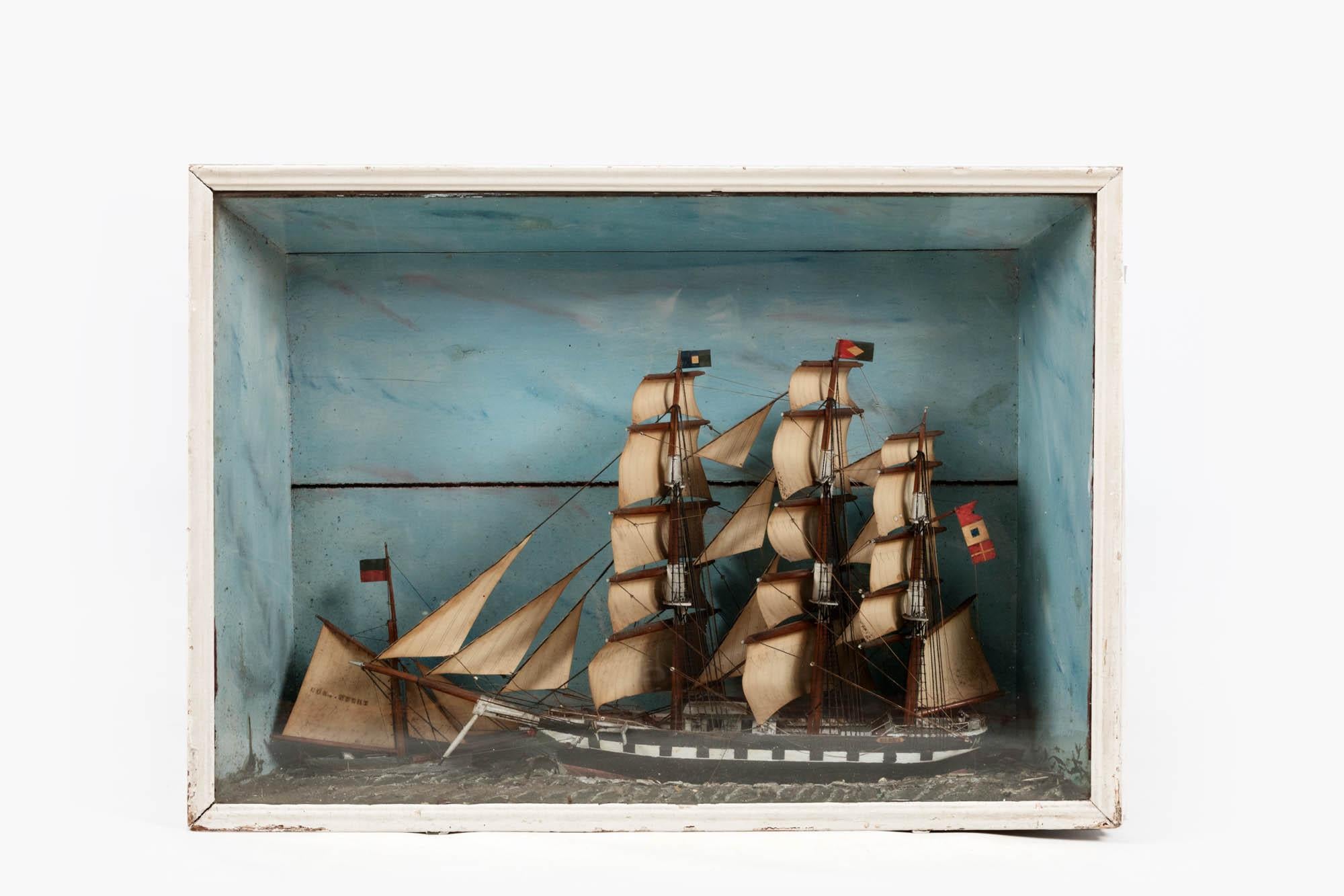 19th Century diorama of the sailing ship ‘Eleanor’ in original glazed case.

Painted antique shadowbox diorama of a three-masthead clipper ship along with tender dinghy sailing alongside.