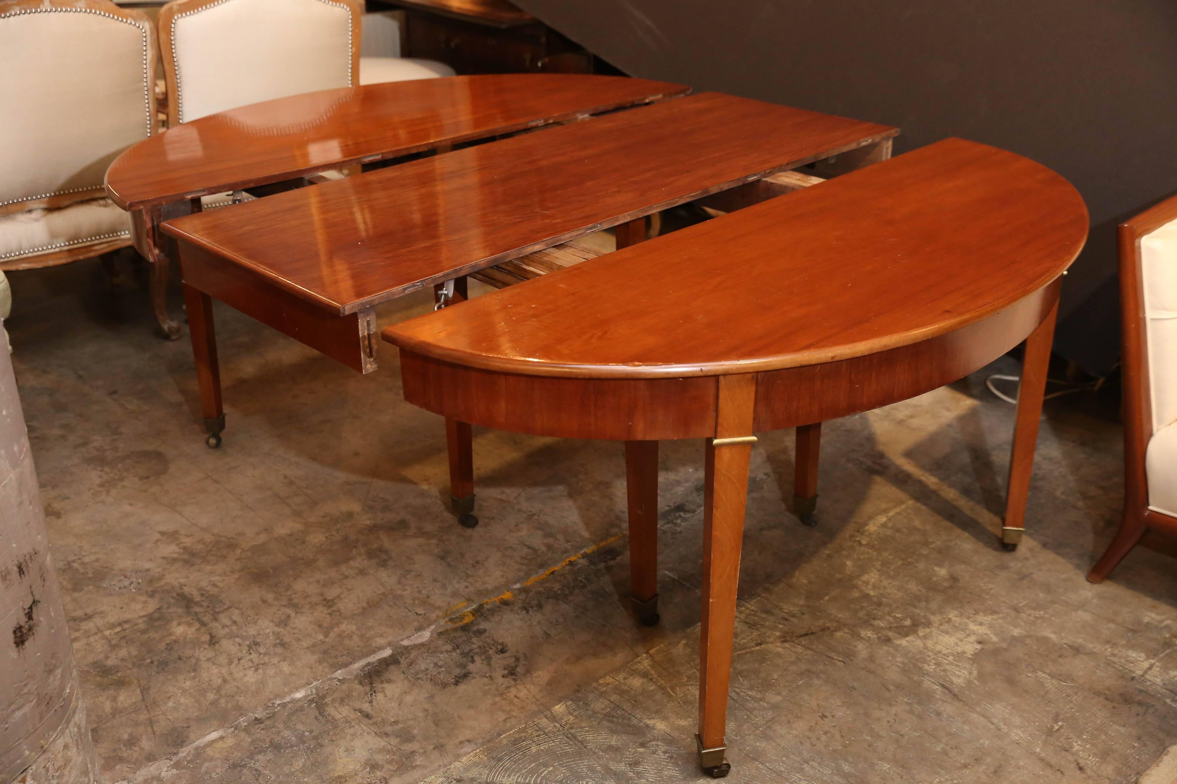 19th century Directoire mahogany dining table has five 21.5