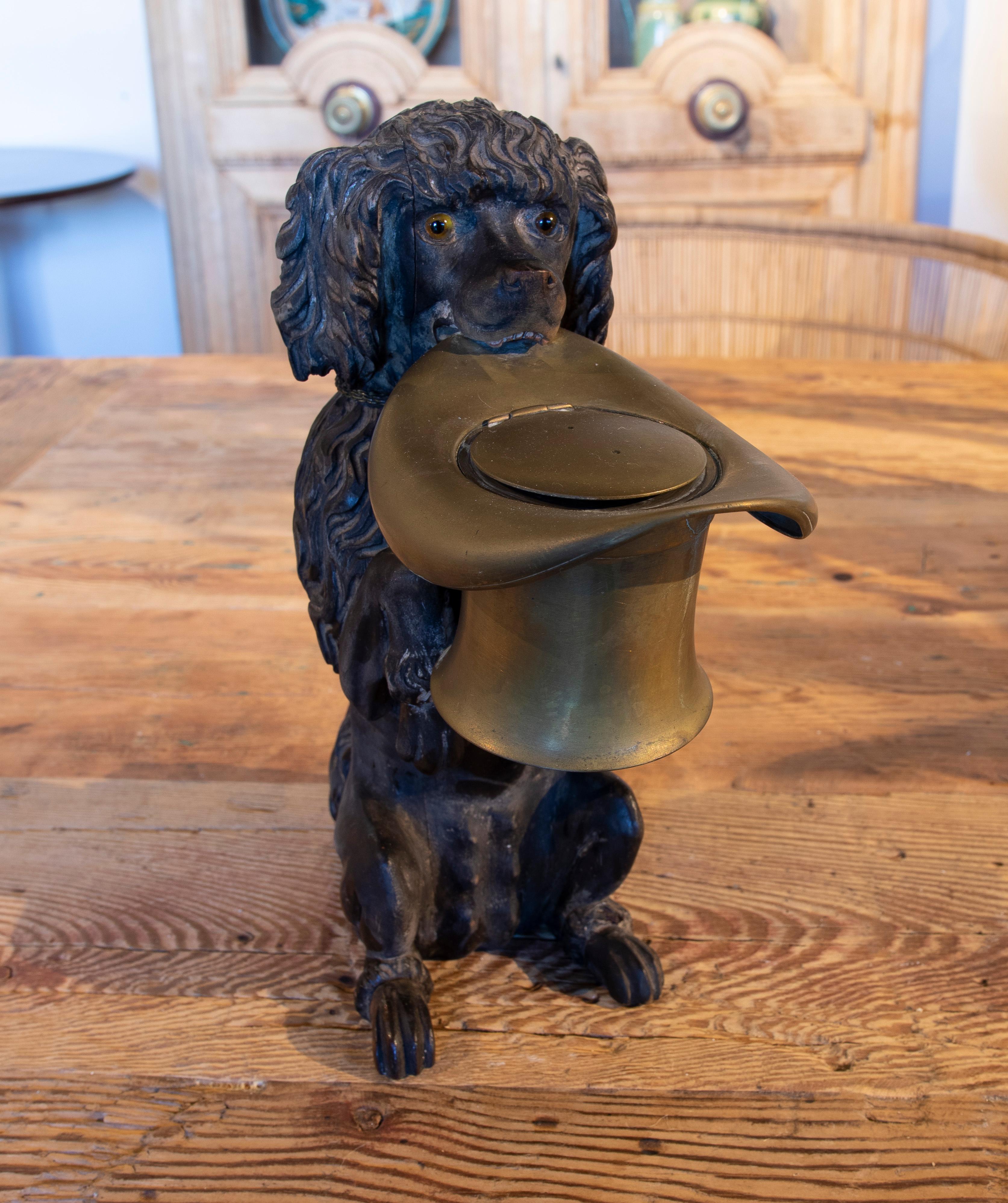 19th century dog-shaped scrip in the shape of a bronze hat.