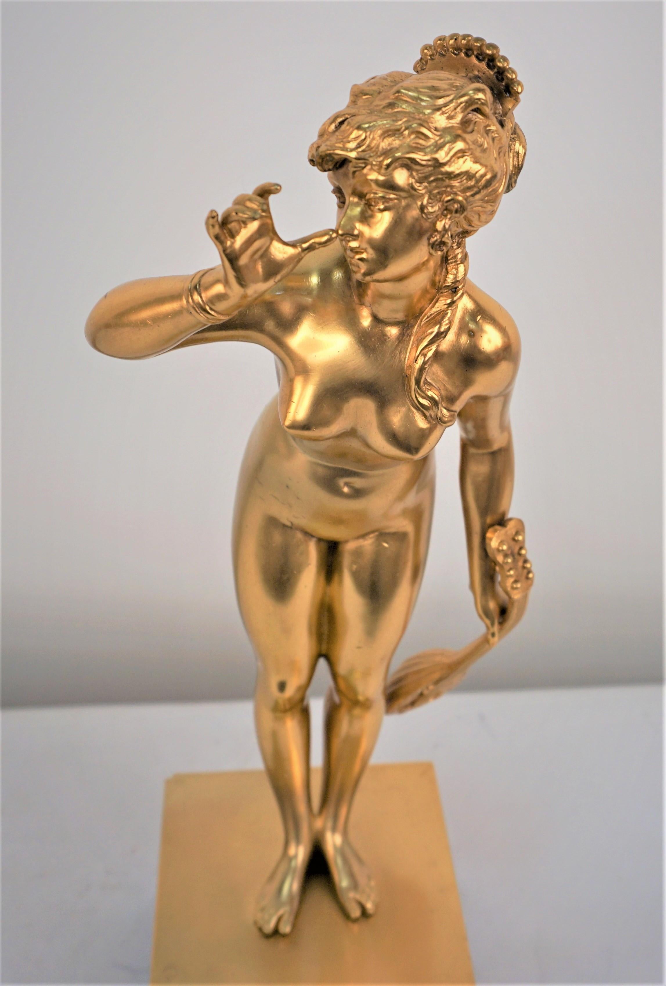 Beautiful Dore bronze statue of woman standing a square base having music instrument in her hand in singing position. 