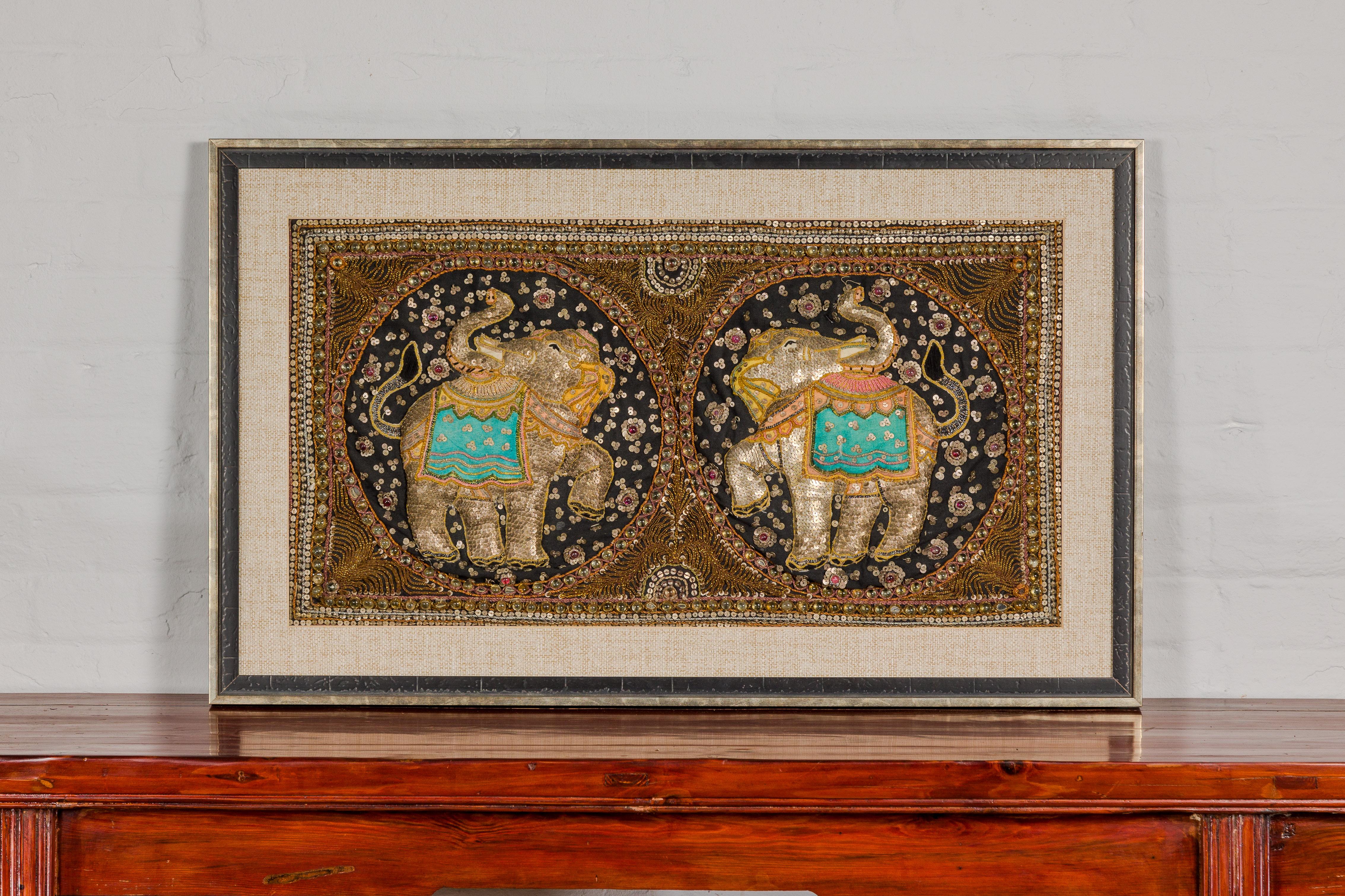 A 19th century Burmese double elephant Kalaga tapestry with sequins, metallic threads and glass beads, in custom frame. This 19th-century Burmese double elephant Kalaga tapestry is an exquisite piece of textile art, masterfully framed to preserve