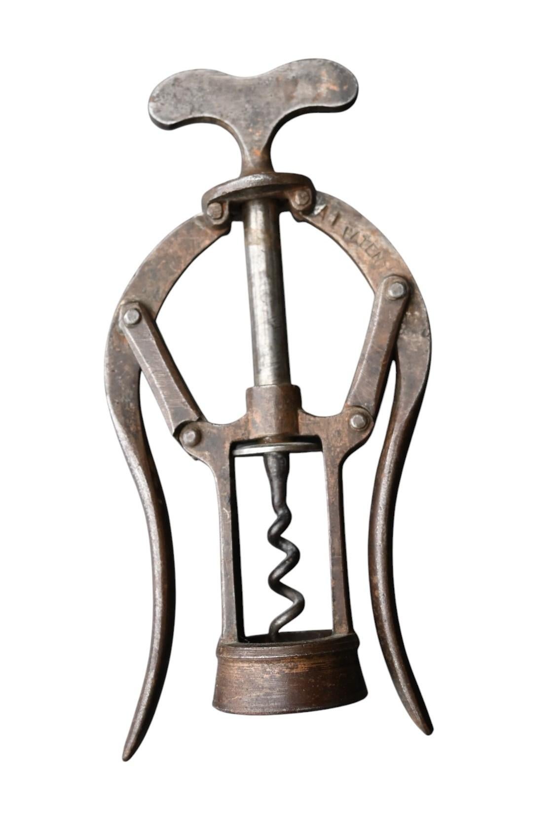 A 19th century 'A1' patent double lever corkscrew by James Heeley & Sons, Birmingham, with simple wire helices and a residual bronze finish. Height 16.5cm
Aged patina
Perfect usable up to today