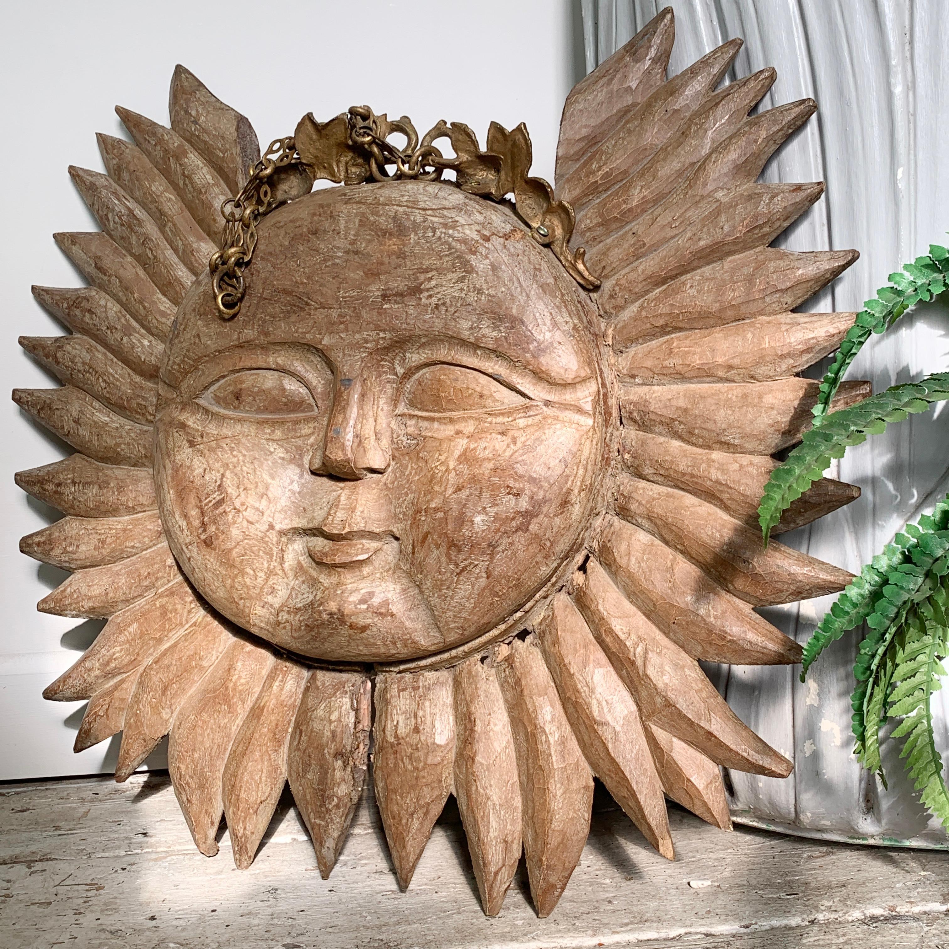 An absolutely captivating deeply carved wooden sun sign, double sided, most likely dating to the early 19th century. This piece has spent much of it’s life outside, probably as a pub sign, where it has built up a fabulous patina in the