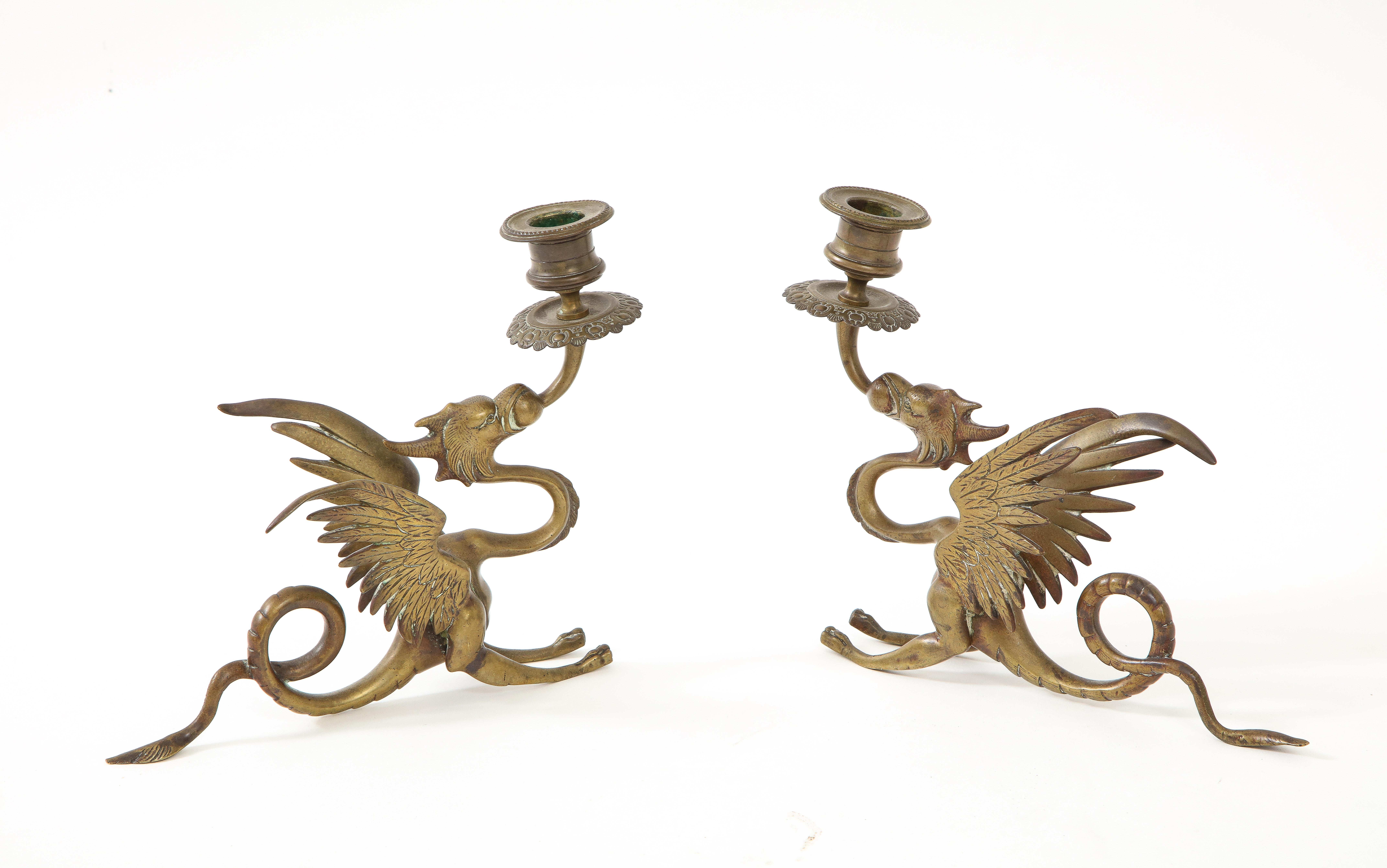 Pair of exqusitely detailed English Victorian era bronze griffin /dragon candlesticks.