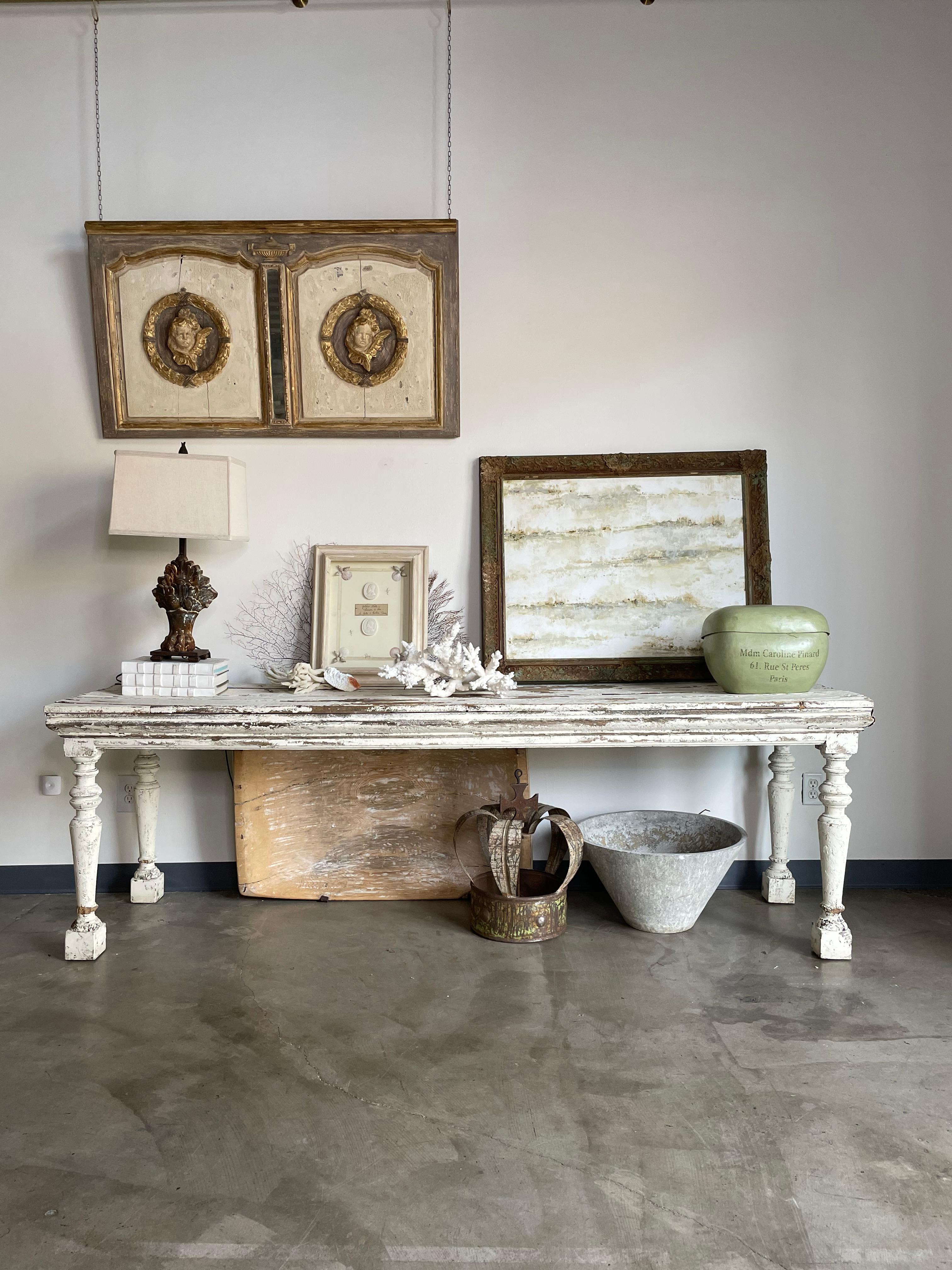 19th century drapers table, repainted. This rustic and crusty table is perfectly sized as a console table for an an entry, or a living space.