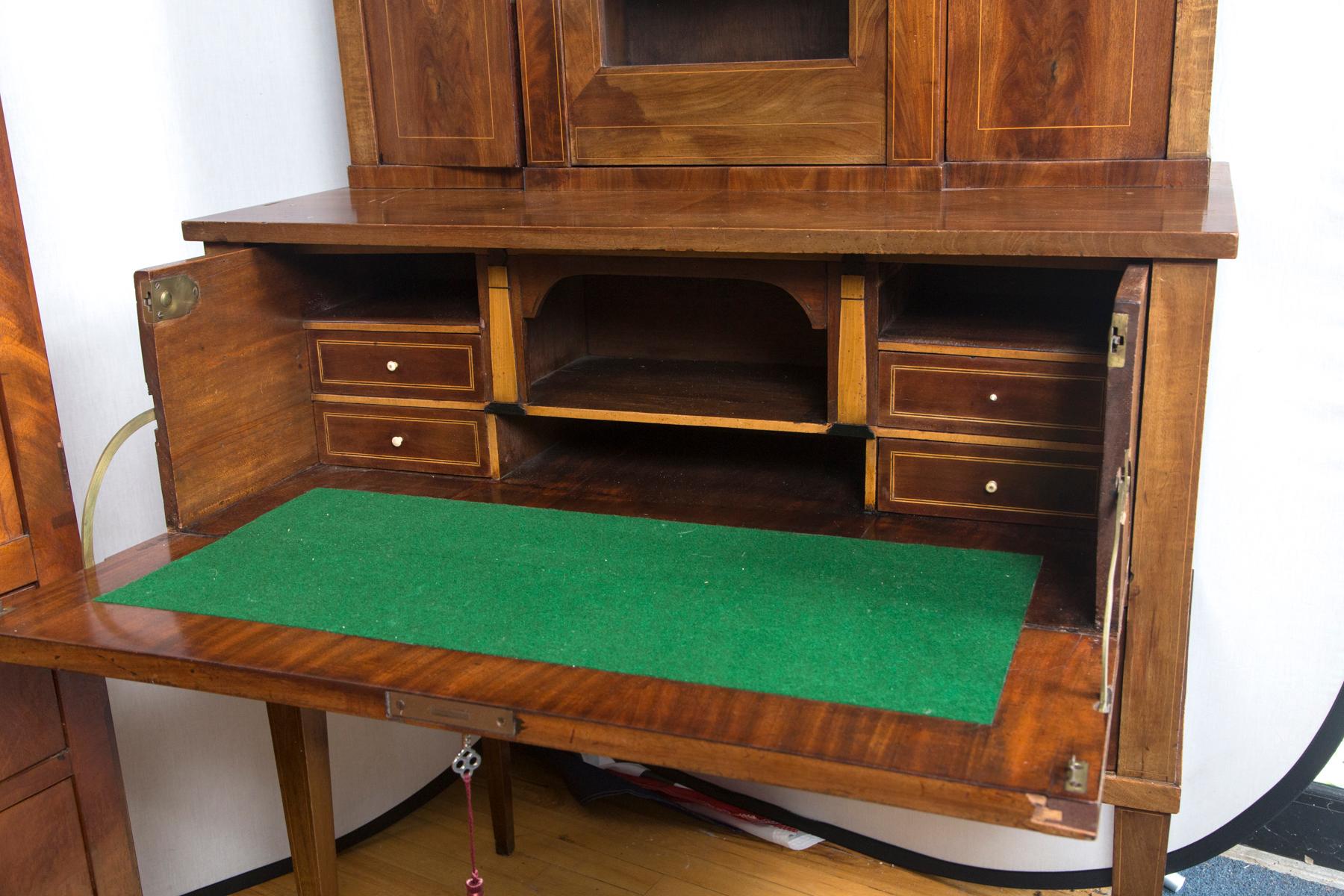 A lovely architectural form secretary with marquetry inlay doors.