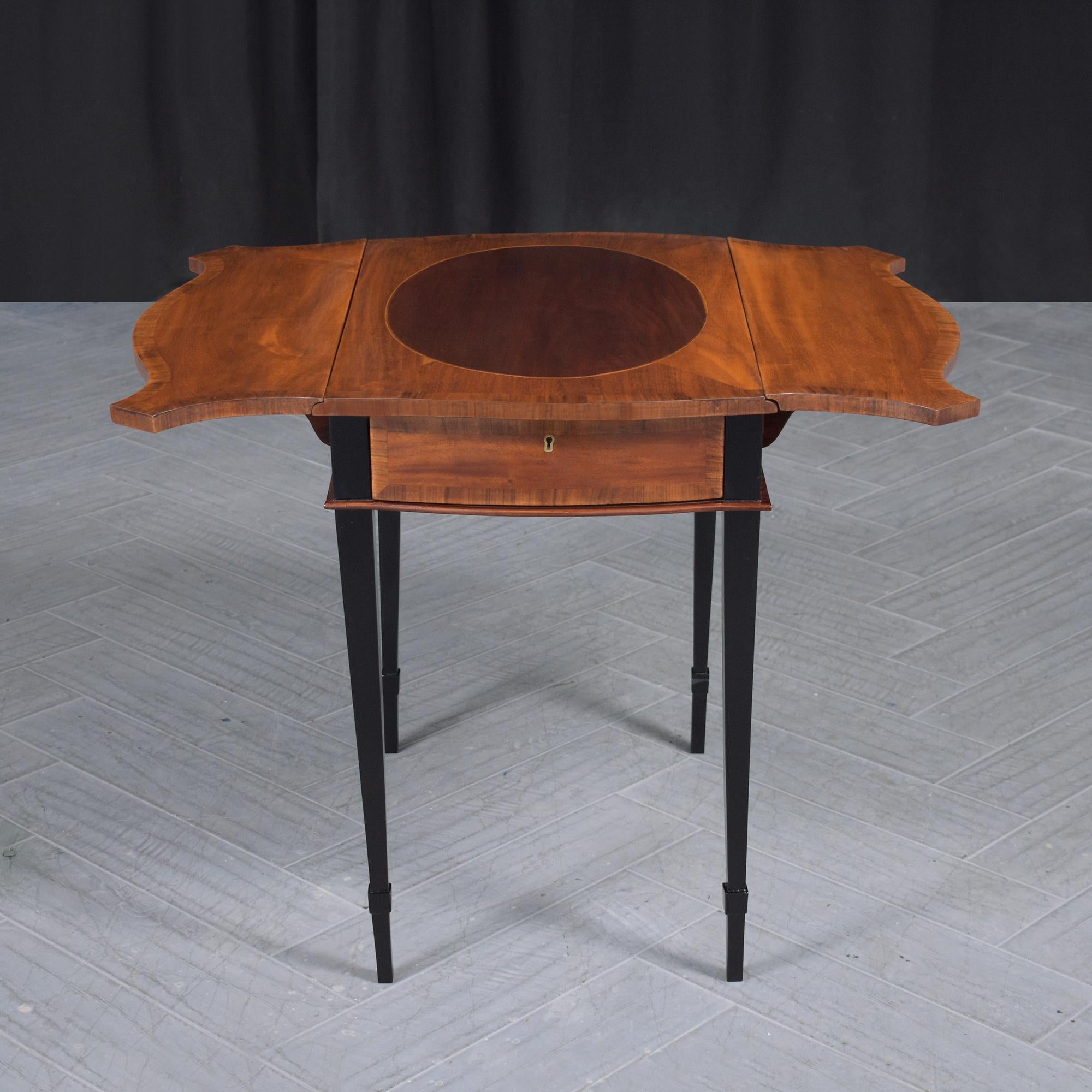 Discover our expertly restored late 19th-century Pembroke table, a testament to fine craftsmanship and timeless elegance. Hand-hewn from resilient mahogany wood, this antique side table gleams with a rich mahogany finish complemented by ebonized