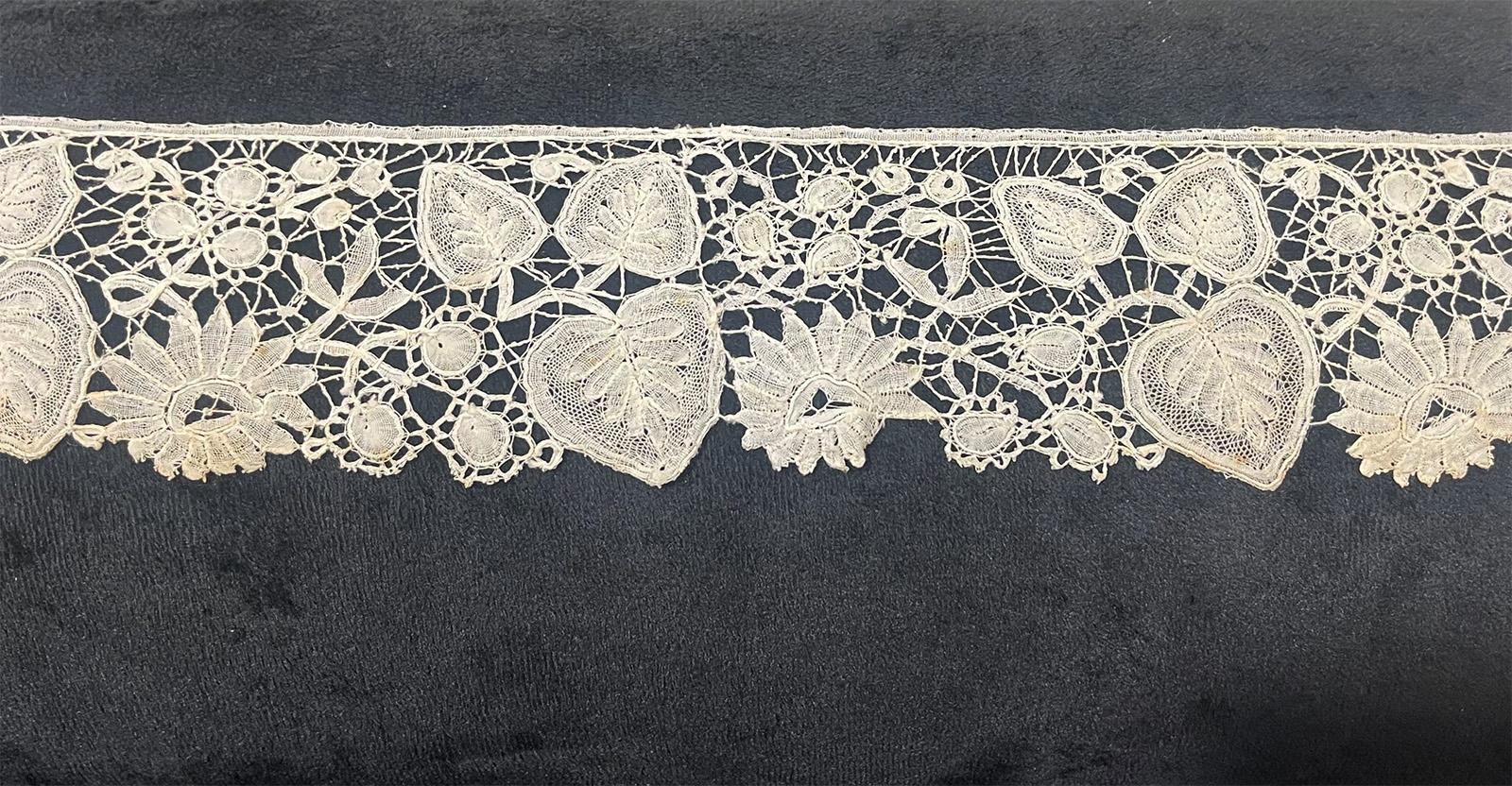 19th Century Duchesse Brussels lace border

A 19th Century Brussels, Duchesse lace border with leaves and flowers. This small piece measures 102 cm long. It is a cream colored lace and has not been used, but does show some slight discolourations.