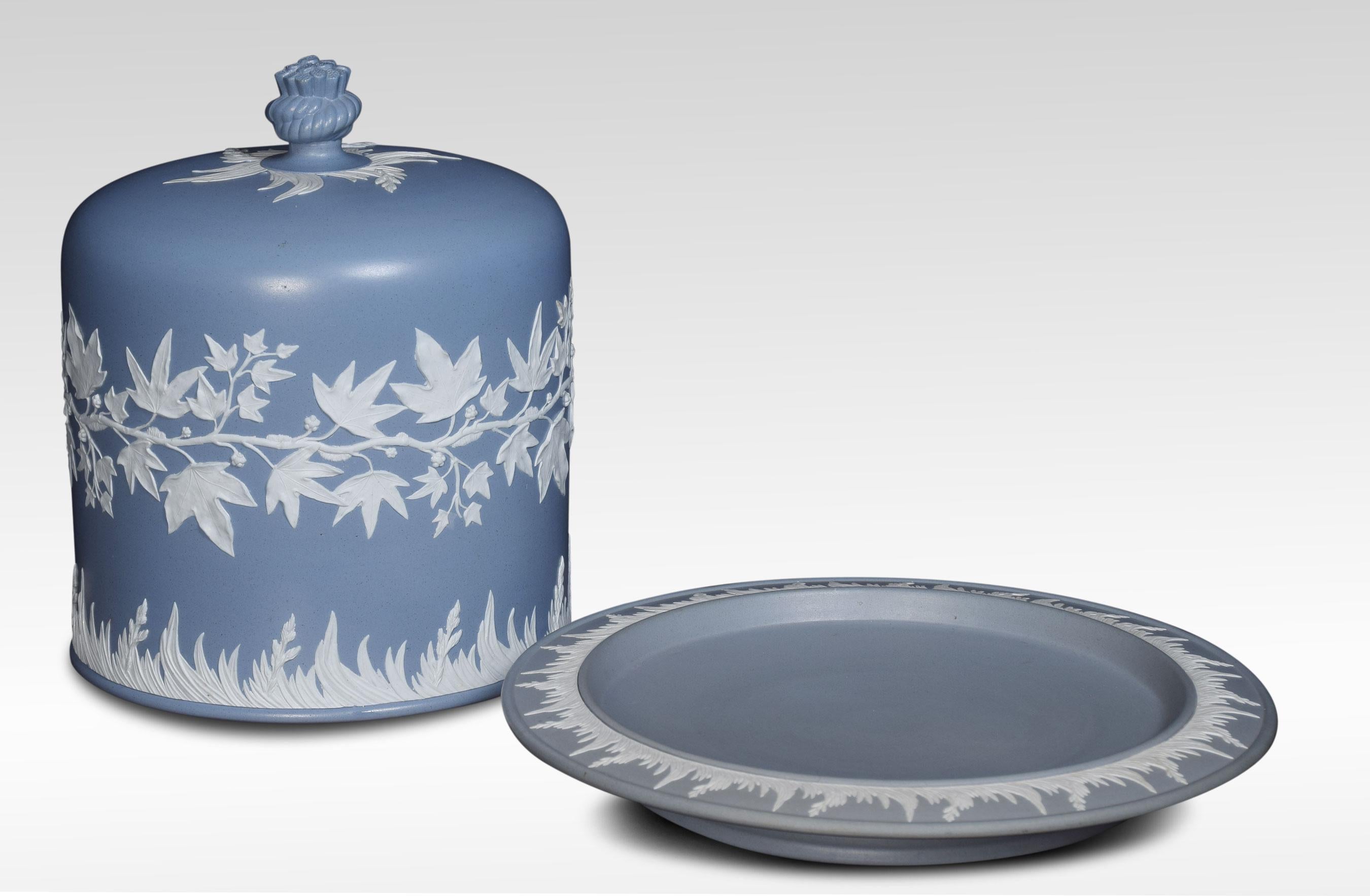 19th century Dudson stoneware cheese dome and stand the dome in a blue ground decorated with a low relief applied band of leaves and berries above grasses. The stand-in a similar relief with a haystack final.
Dimensions:
Height 12 inches
Width