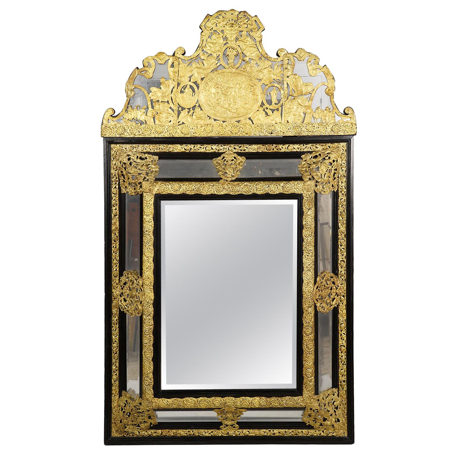 19th Century Dutch Baroque Style Ebonized and Repoussé Gilt Metal Framed Mirror