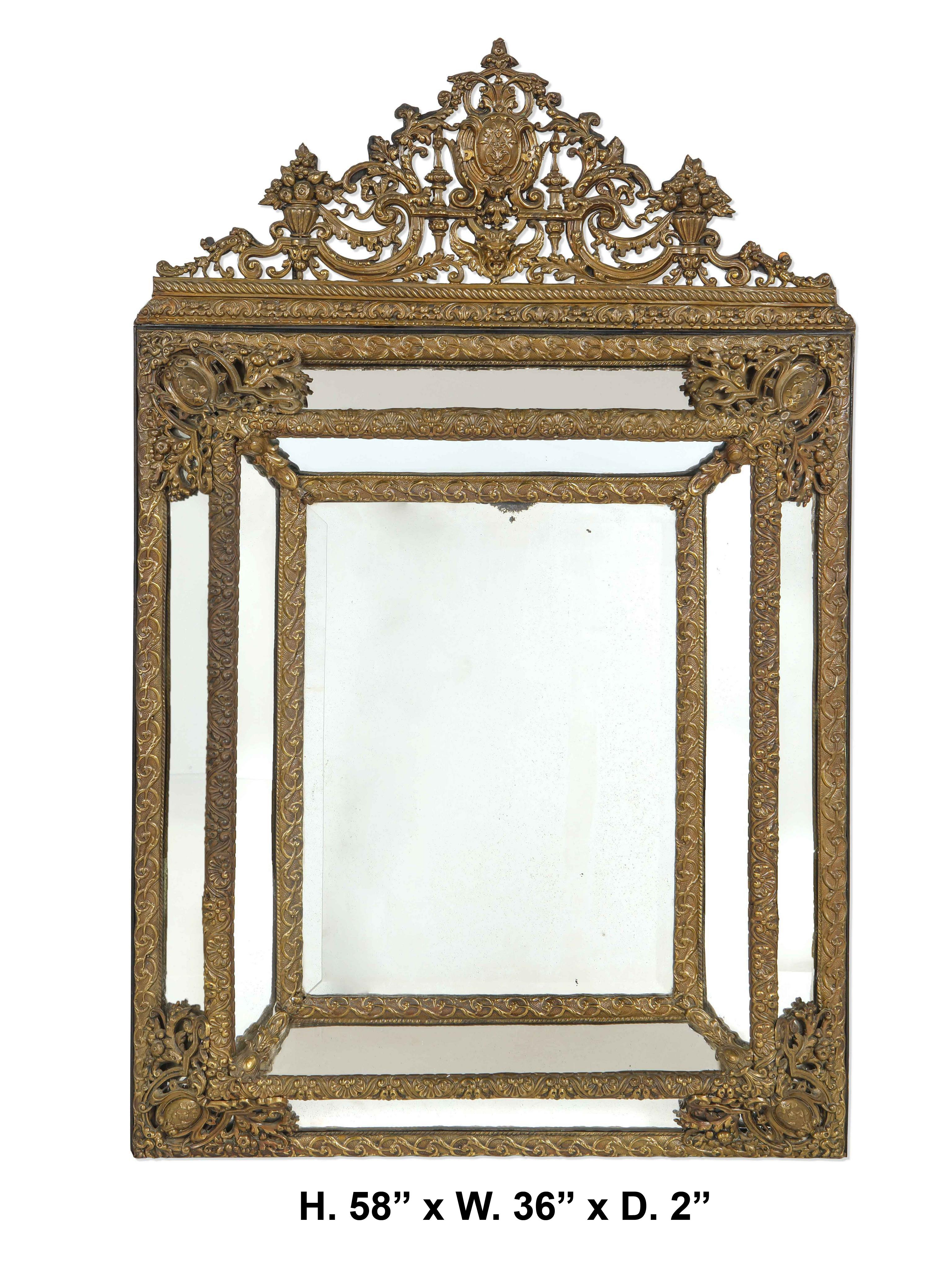 Impressive 19th century Baroque style repousse mirror.
The beautiful brass repousse work with intricate design full of fretwork on ebonized frame and original mirror.