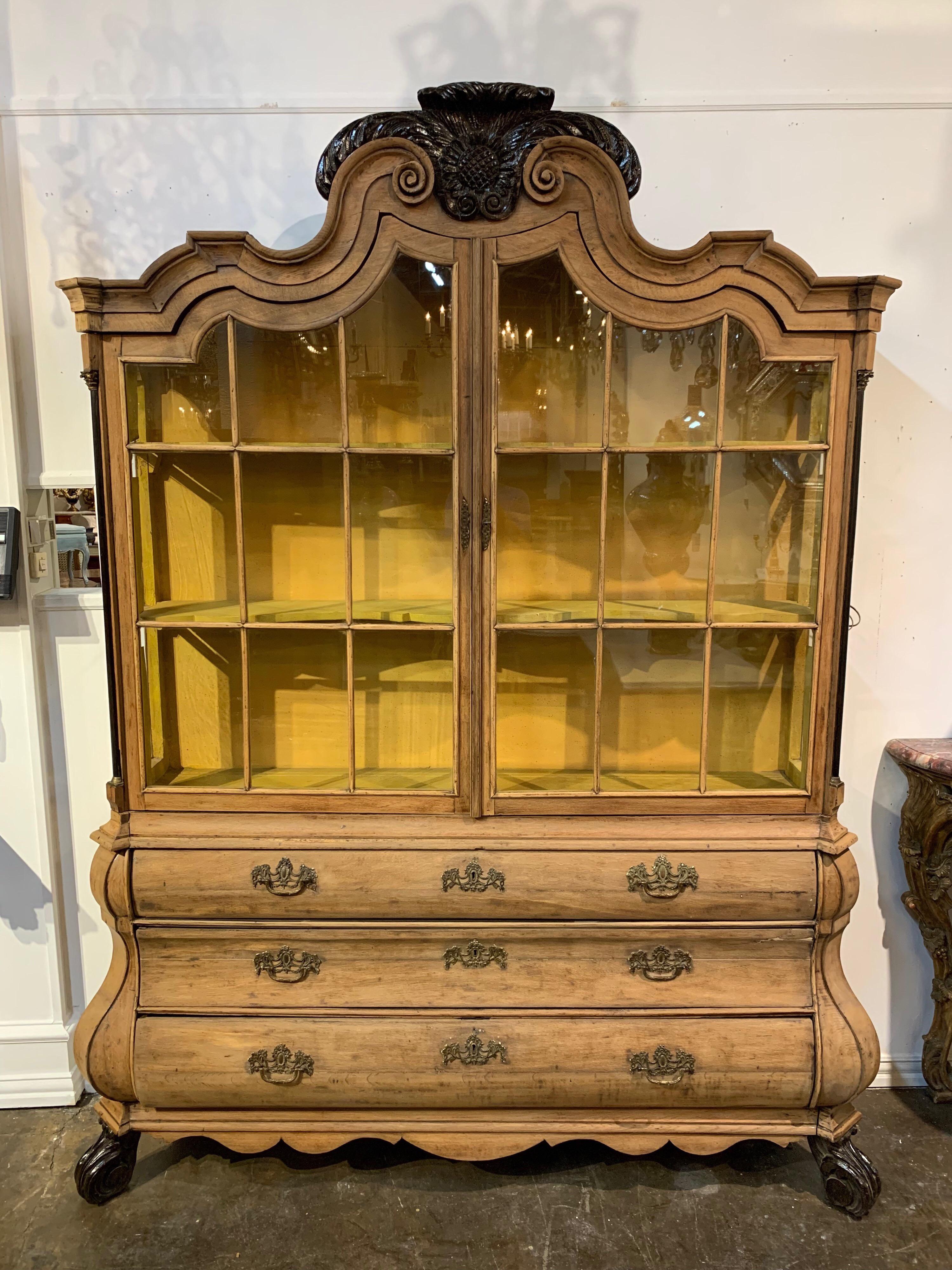 Very fine 19th century Dutch bleached oak and ebonized display cabinet. Beautiful carvings and abundant storage as well. A truly unique piece.