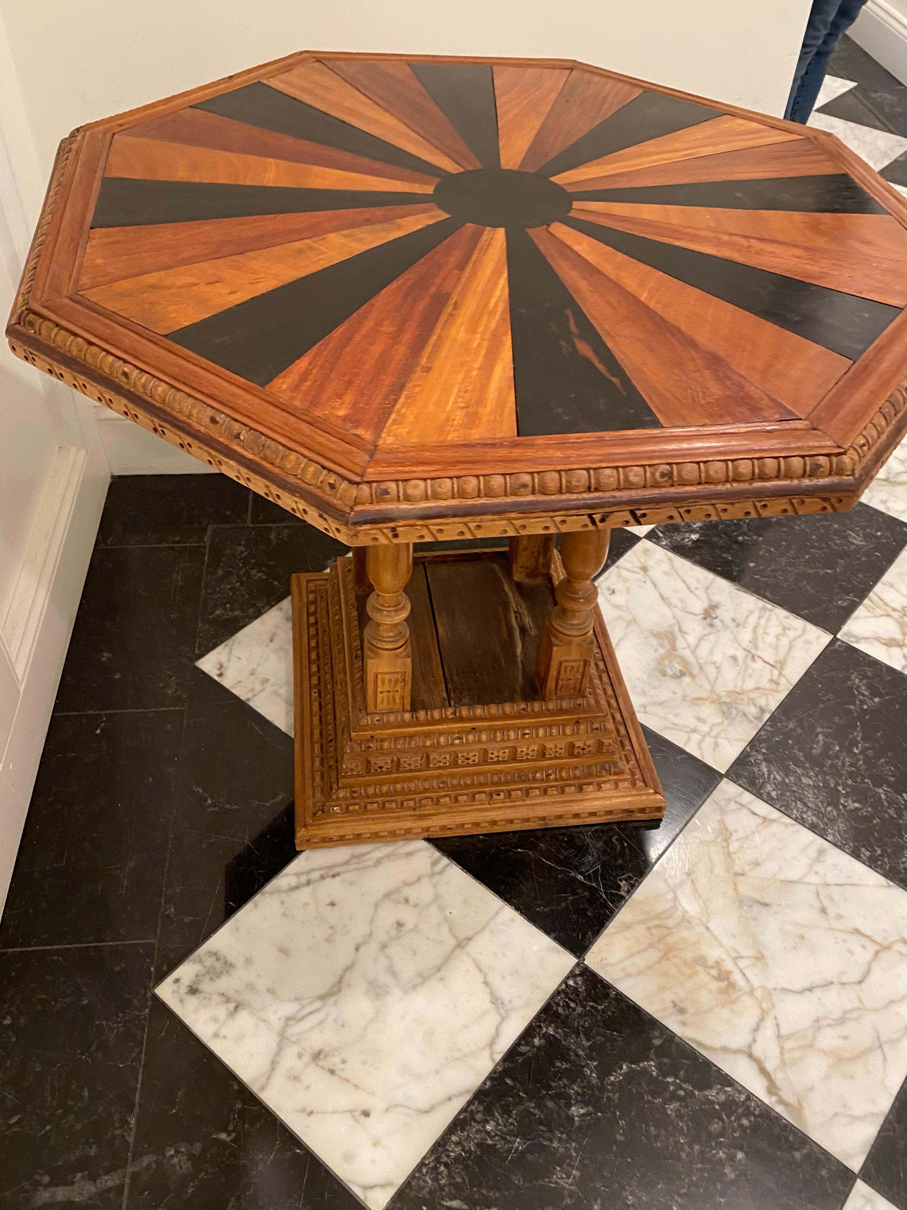 19th century Dutch Ceylonese specimen table, circa 1890. Handmade in the Dutch style with a Ceylonese twist on the base in Sri Lanka. Various woods include: Nadoun, satinwood, mahogany, and ebony inlay. This is a nice height table next to a sofa or