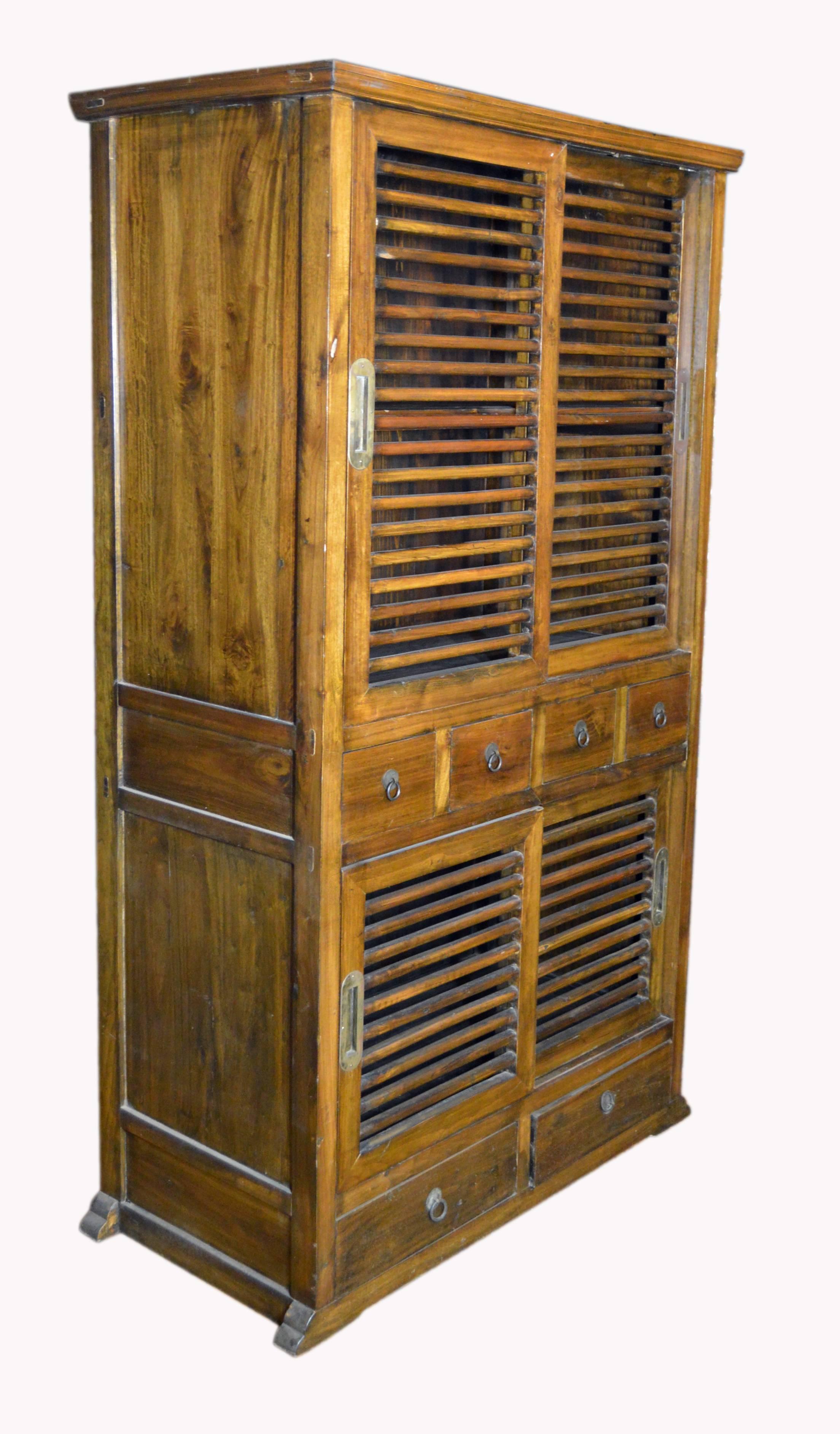 Indonesian 19th Century Dutch Colonial Armoire with Fretwork Sliding Doors and Drawers