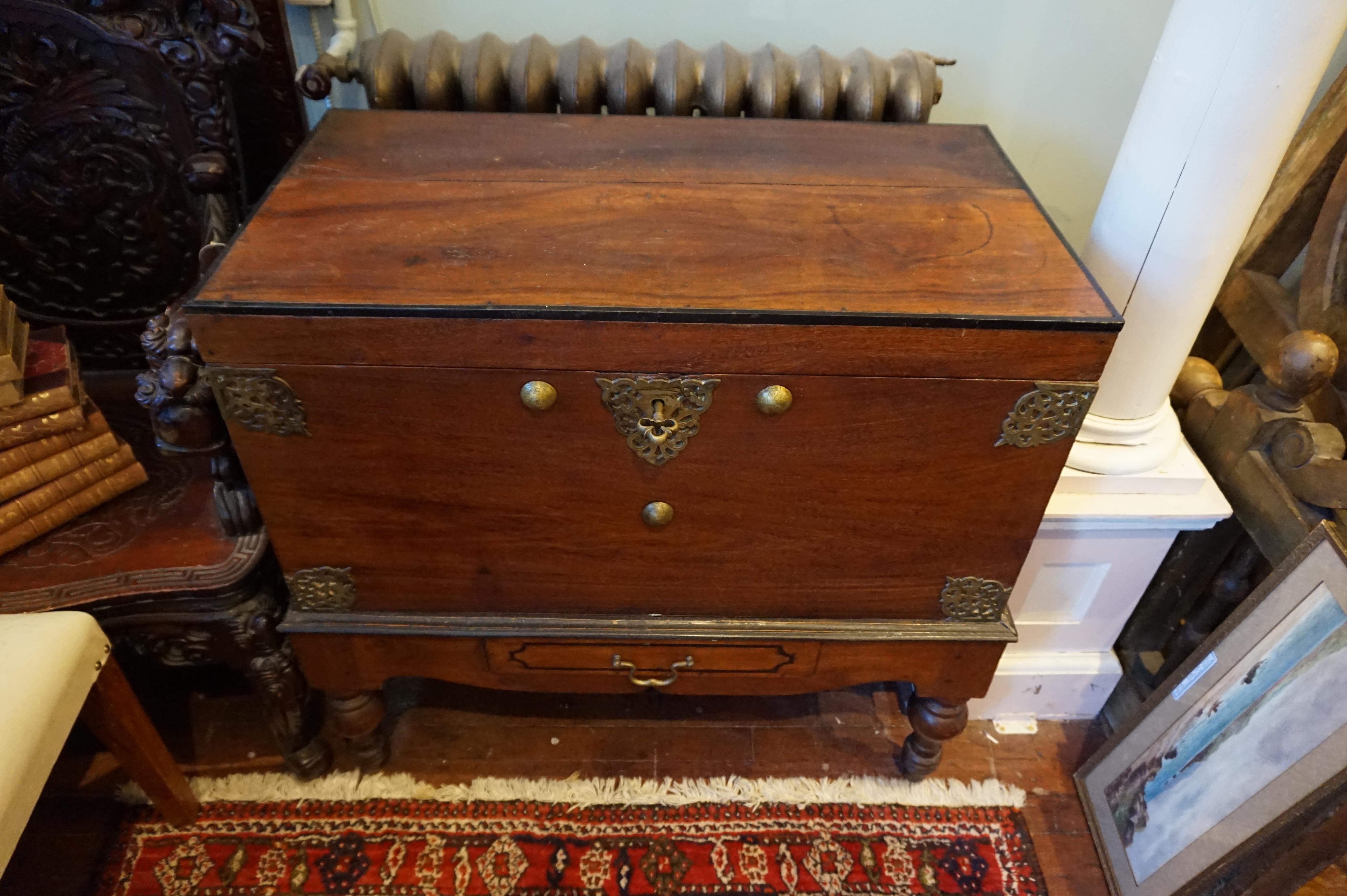 Dutch Colonial mahogany chest.
Fine Dutch Colonial chest with original brass work and surviving key. Peg work joinery, vase turned feet and drawer at base. Solid and sturdy construction exuding warmth and character,
circa 1880s
Origin: Ceylon.