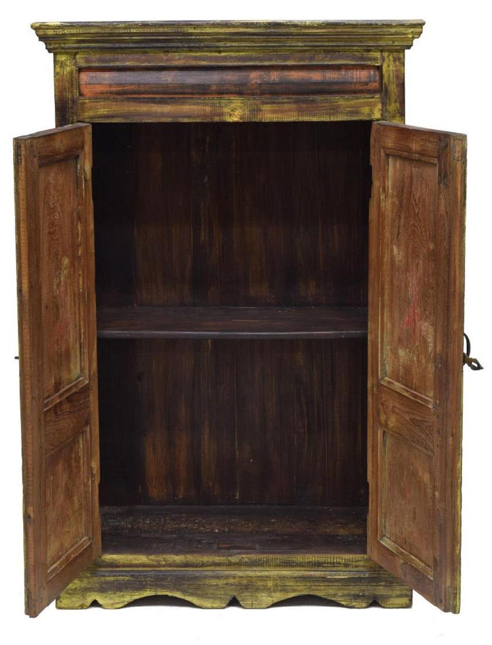 This Dutch Colonial kitchen cabinet is from the 19th century, and has a corniced top, over two-door cabinet, with iron hardware, shelves to interior, rising on scalloped base, bracket feet, with remnants of yellow and orange paint.

Dimensions