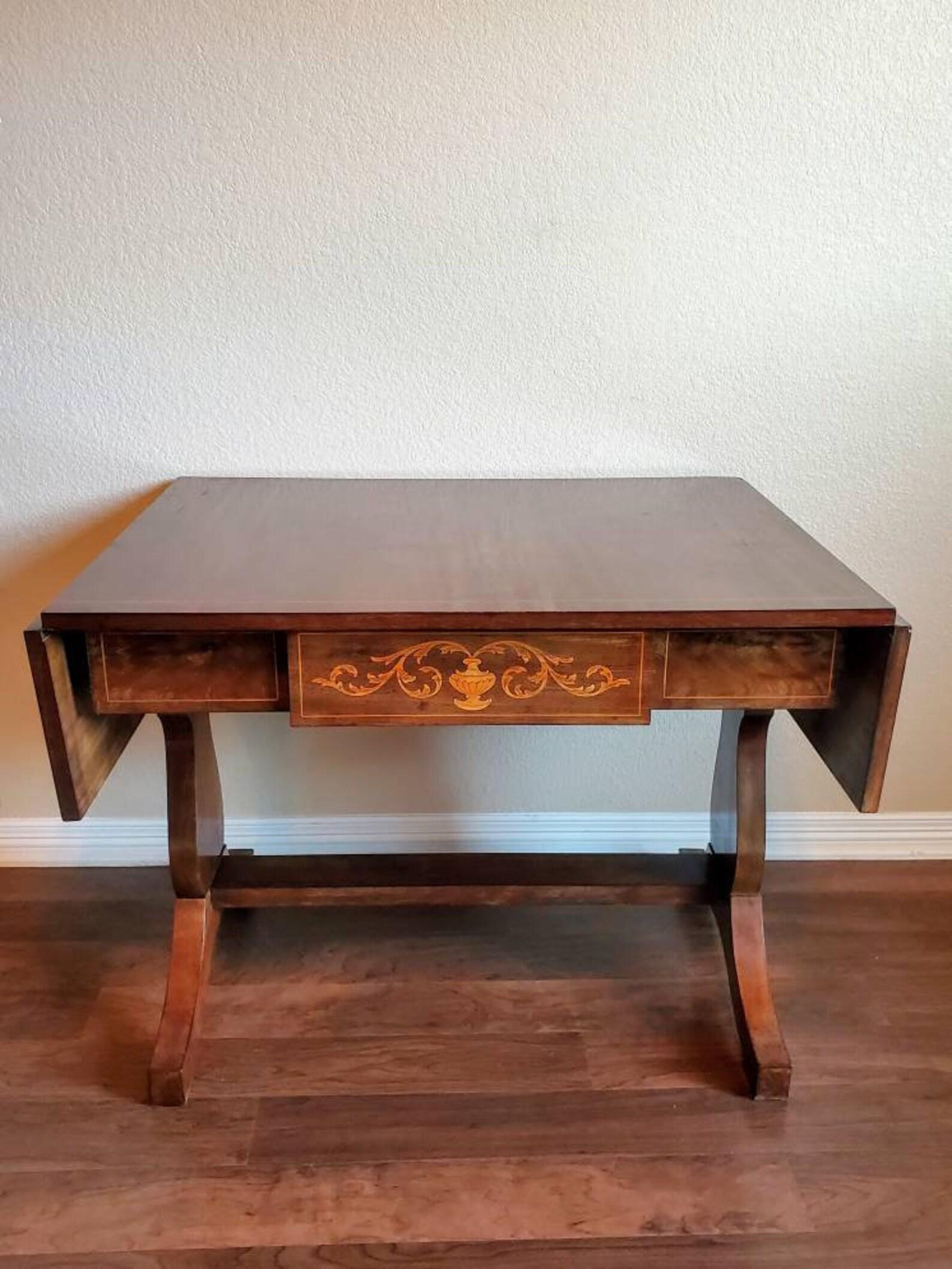 Sophisticated elegance, is what comes to mind when setting eyes upon this richly colored rosewood veneered Biedermeier drop-leaf table from the mid-late 19th century. 

Continental European origin, likely Denmark, hand-crafted, finished in Dutch