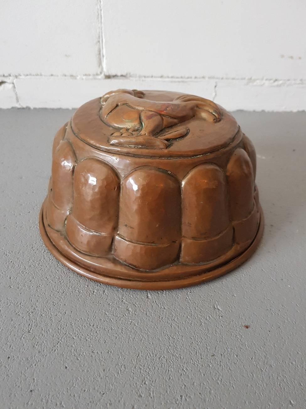 Decorative in any kitchen this 19th century Dutch copper cake mold with tinned inside and picture of a rooster on top.

The measurements are,
Depth 20.5 cm/ 8 inch.
Width 20.5 cm/ 8 inch.
Height 10 cm/ 3.9 inch.
 