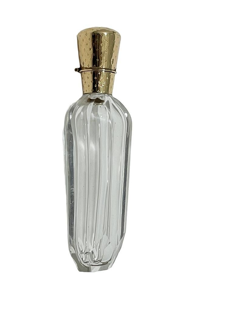 19th Century Dutch crystal and gold perfume bottle by H.A.M. van Tongeren, 1870s

A 19th Century Dutch perfume bottle with golden hinged cap with stopper. The crystal perfume bottle has an octagonal crystal cut flat body and is rounded to hextagonal
