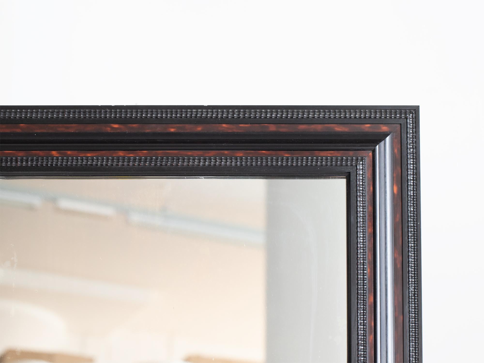 A faux tortoiseshell and ebonised ripple mirror. Dutch, 19C.

In very good order with minimal losses. Original plate and backboards.

80 x 65 x 3.5 cm

31.5 x 25.6 x 1.4 