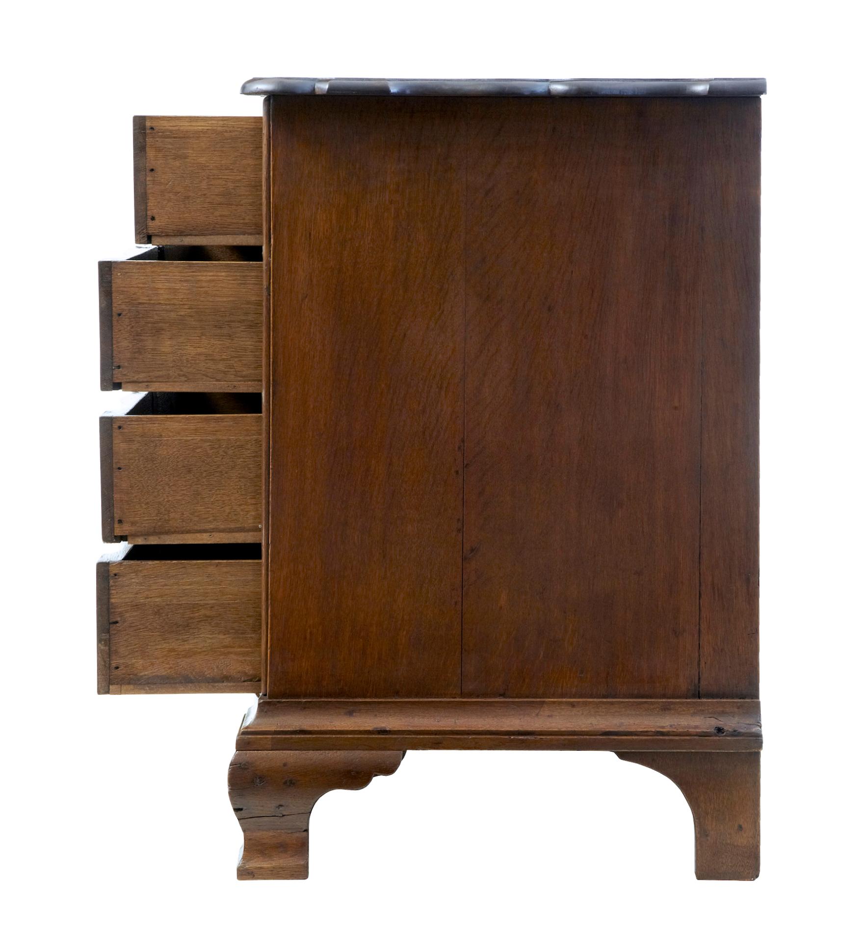 19th century Dutch shaped oak chest of drawers commode, circa 1890.

Serpentine fronted commode very much in the Dutch taste. 4 drawers with original brass rope ring handles and escutcheons.

Standing on ogee bracket feet.

Minor surface