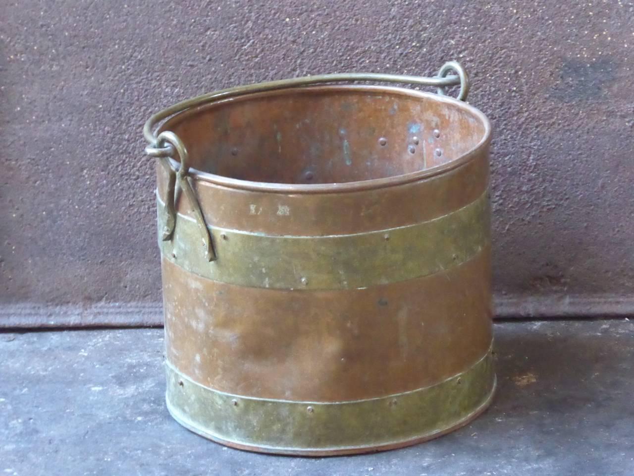 19th century Dutch log holder - log bin made of copper and brass.

We have a unique and specialized collection of antique and used fireplace accessories consisting of more than 1000 listings at 1stdibs. Amongst others, we always have 300+ firebacks,
