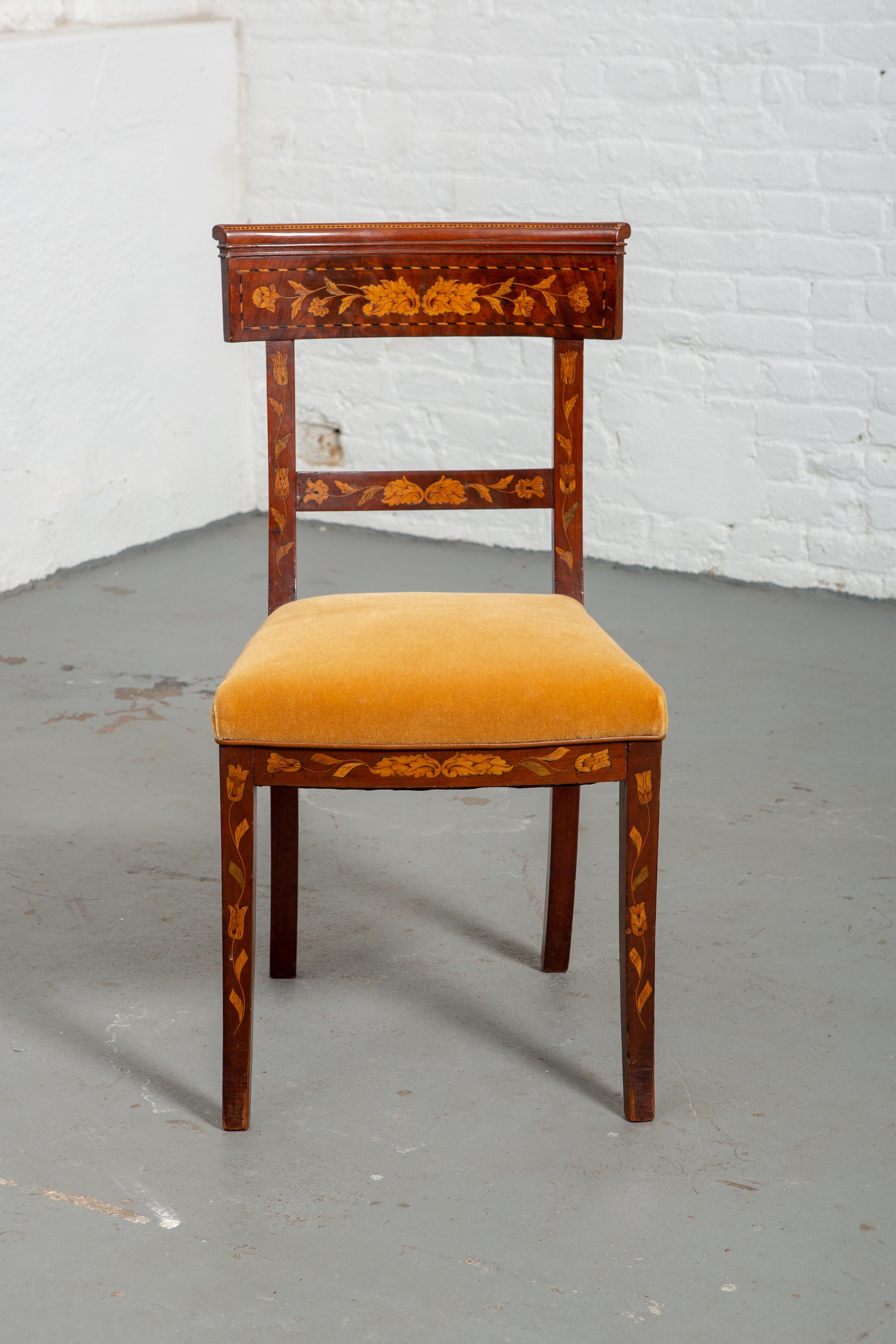 19th century Dutch marquetry side chair with new velvet upholstery. Carved wood floral details throughout. Curved back and curved and tapered legs. Wood is in very good original condition.
Seat width - 18.75
