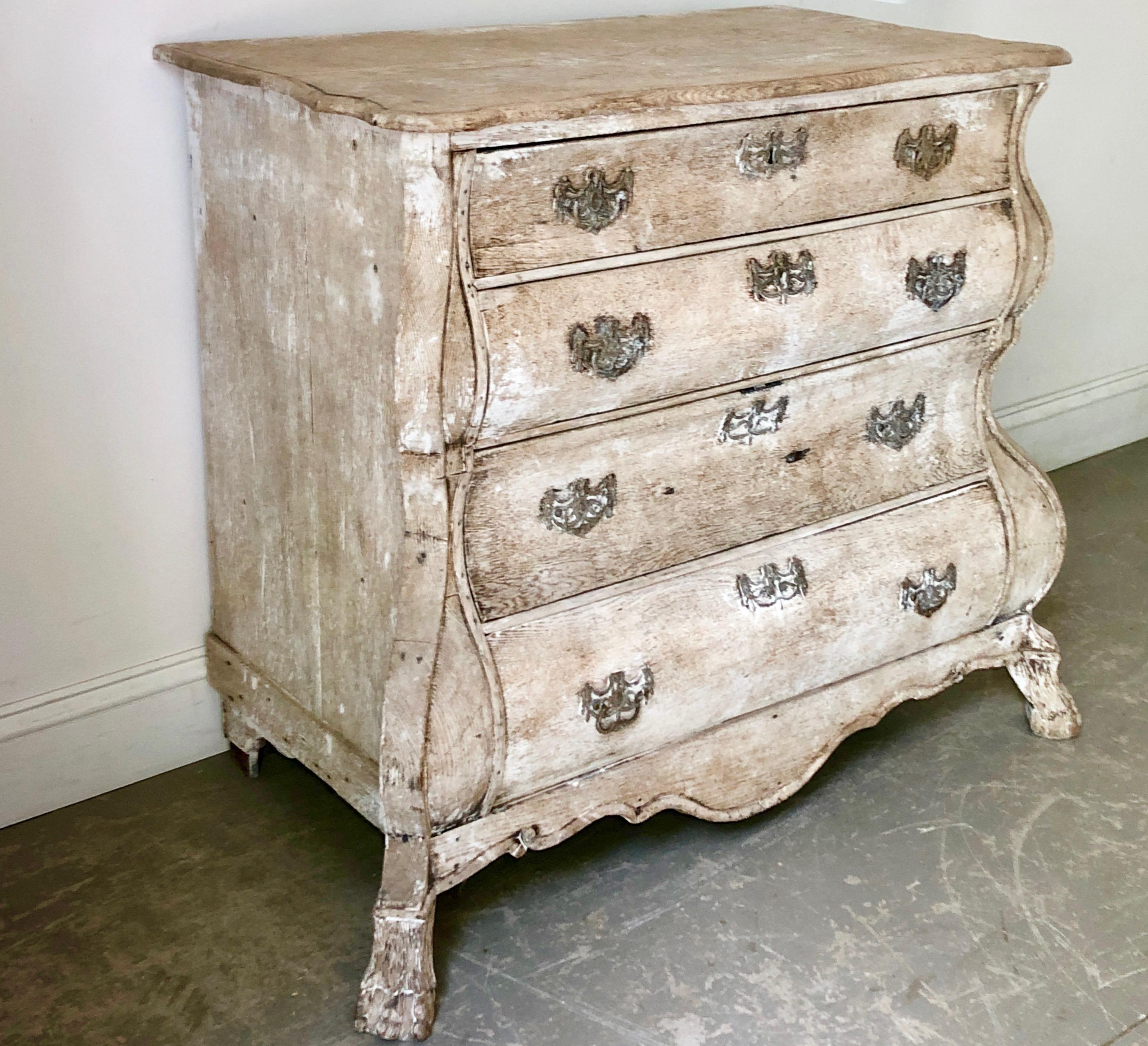 A very carved charming bombe front Dutch commode in bleached oak with original bronze hardwares. Holland, circa 1860 
More than ever, we selected the best, the rarest, the unusual, the spectacular, the most charming what makes people dreaming!